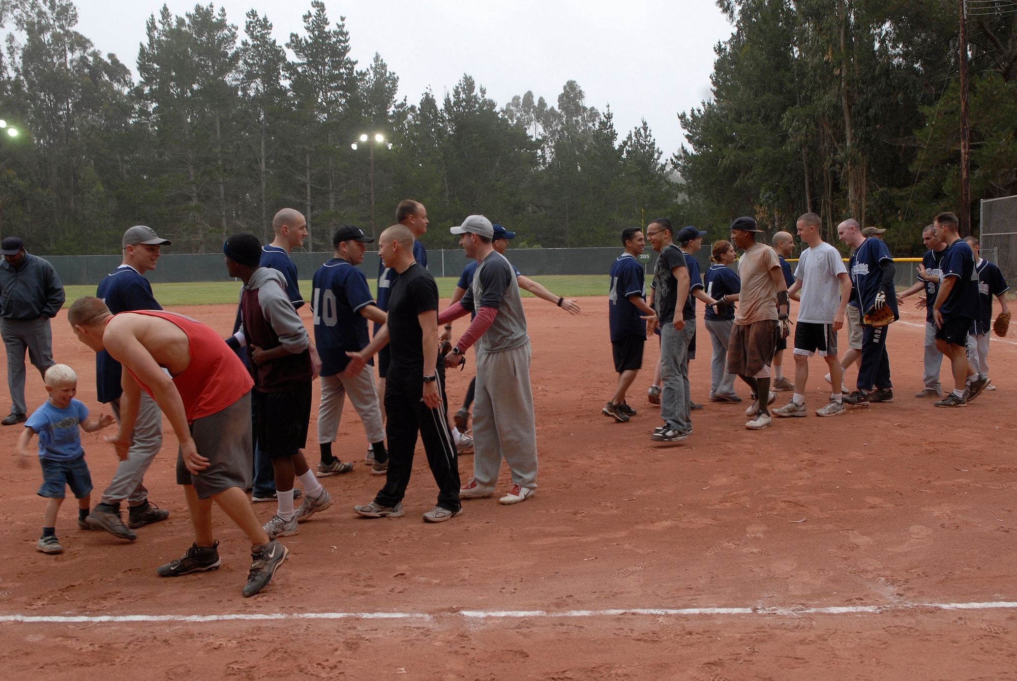 VANDENBERG AIR FORCE BASE, Calif. --  The 533rd Training Squadron team shakes hands with the 381st Training Support Squadron team after an intramural softball game at the base field here Monday, June 7, 2010.  The 533rd TRS won the game 31-2.  (U.S. Air Force photo/Senior Airman Andrew Satran) 

 
 

 
 
 

 
 