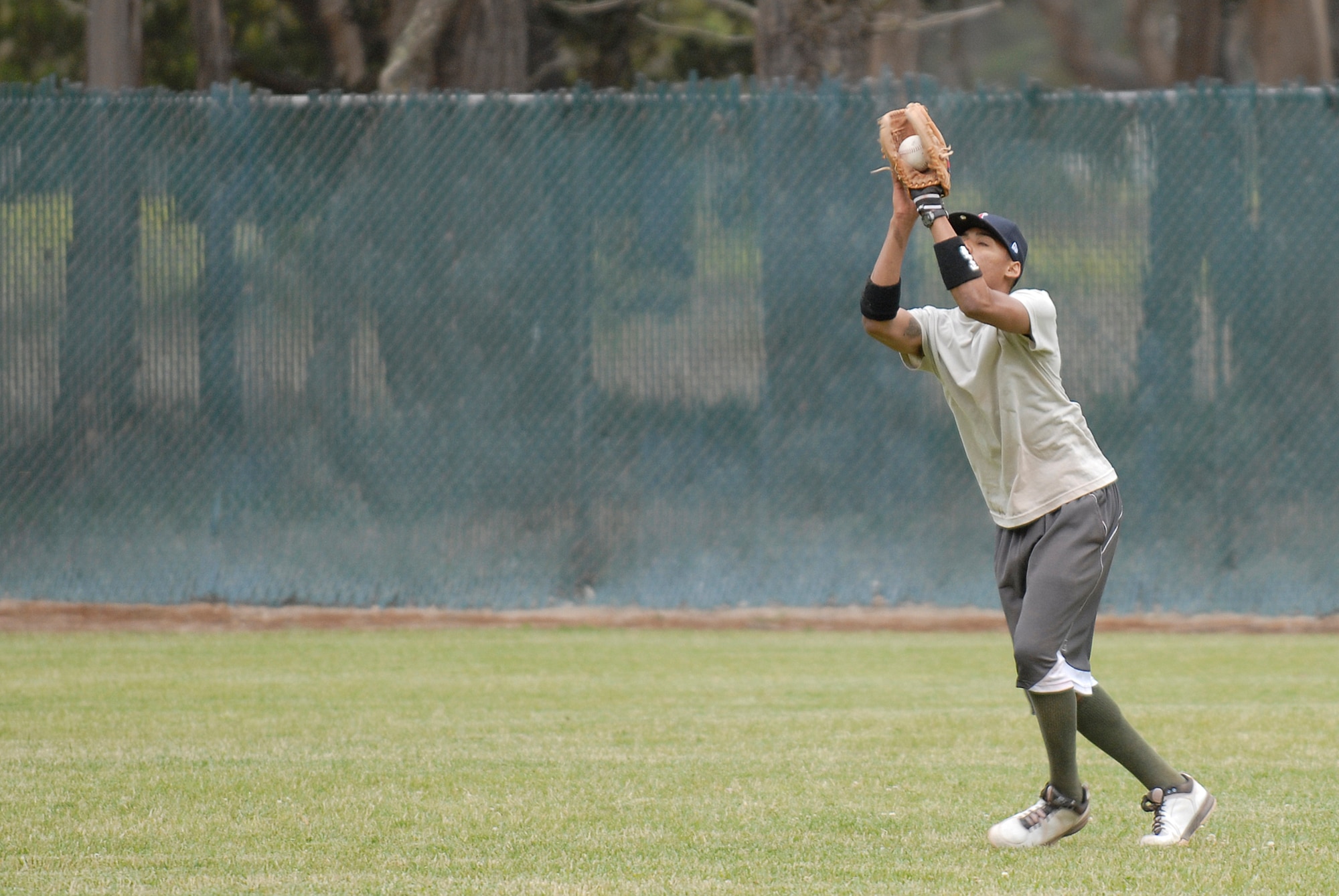 VANDENBERG AIR FORCE BASE, Calif. --  Paul Davis, a 381st Training Support Squadron team member, makes the catch during an intramural softball game at the base field here Monday, June 7, 2010.  The 533rd Training Squadron team won the game 31-2.  (U.S. Air Force photo/Senior Airman Andrew Satran) 

 

 
 
 

 
 