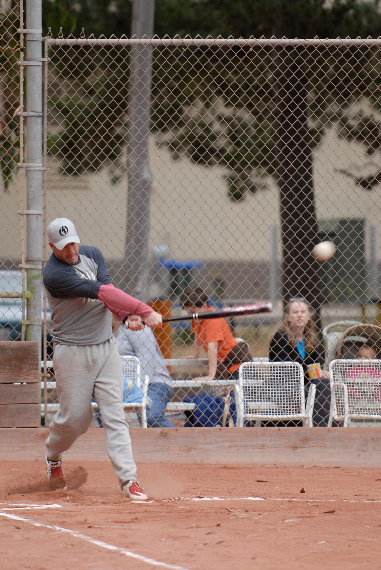 VANDENBERG AIR FORCE BASE, Calif. --  Up at bat, Thomas Early, a 381st Training Support Squadron team member, whacks the ball during an intramural softball game at the base field here Monday, June 7, 2010.  The 381st TRSS team were defeated by the 533rd TRS team 31-2.  (U.S. Air Force photo/Senior Airman Andrew Satran) 

 
 

 
 