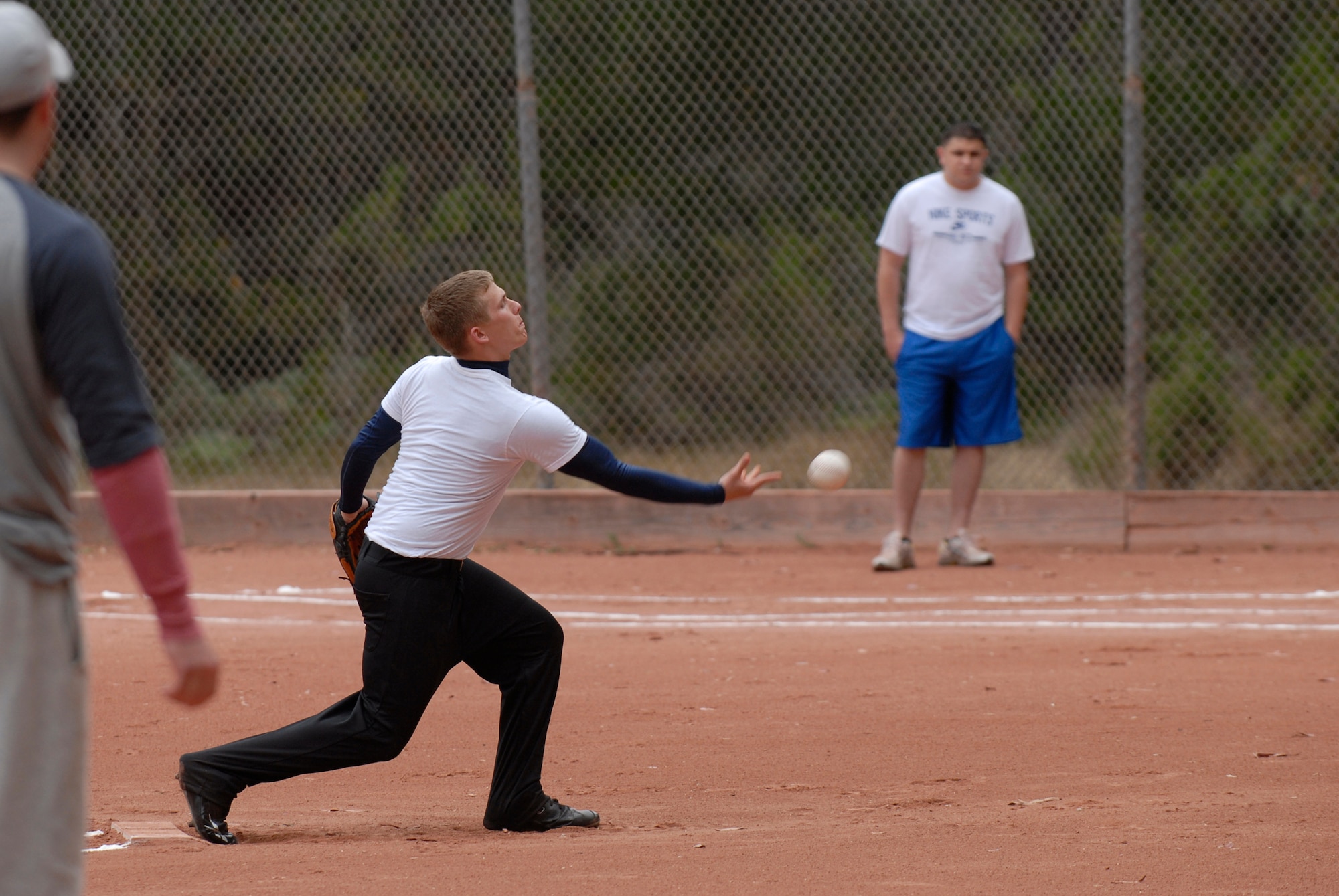 VANDENBERG AIR FORCE BASE, Calif. --  Pitching for his team, Patrick Clowers, a 381st Training Support Squadron team member, tosses a softball during an intramural softball game at the base field here Monday, June 7, 2010.  The 381st TRSS opponent was the 533rd Training Squadron team.  (U.S. Air Force photo/Senior Airman Andrew Satran) 

 
 