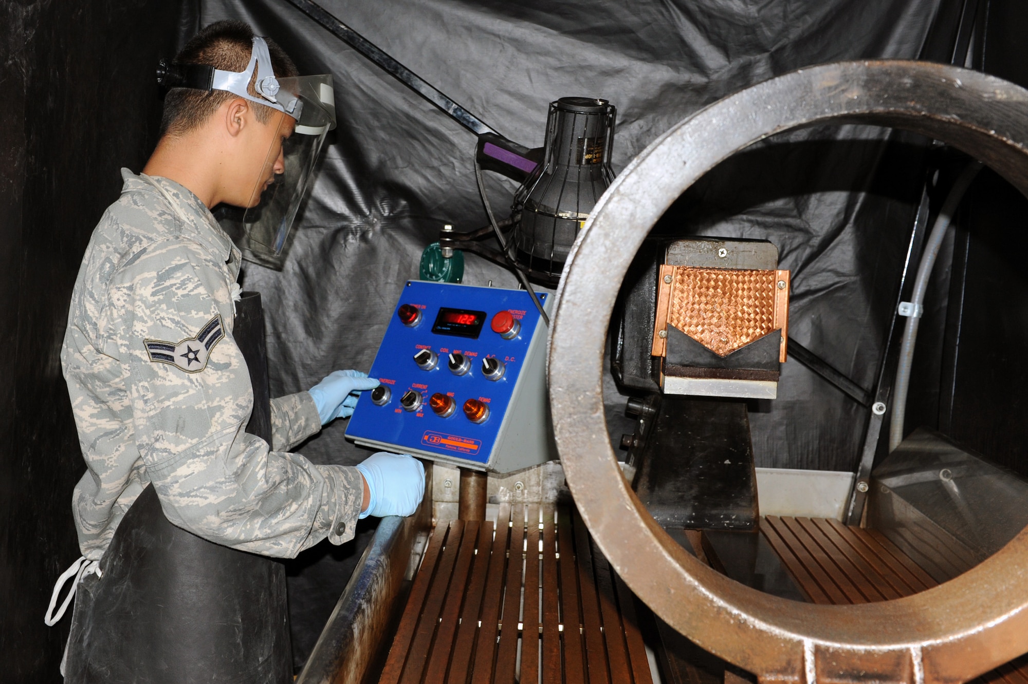 Airman 1st Class Ashton Surber, 19th Equipment Maintenance Squadron non-destructive inspection journeyman, prepares to charge a magnetic coil June 4, which is used to magnetize metal at the base non-destructive inspection lab. (U.S. Air Force photo by Senior Airman Ethan Morgan)