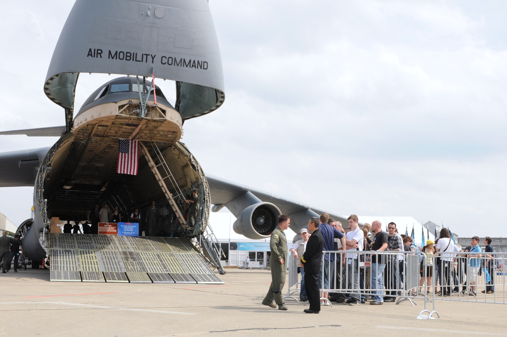 BERLIN -- Visitors line up to see the C-5 Galaxy during the ILA 2010 Berlin International Aerospace Exhibition and Conferences Air Show June 8 at Berlin-Schonefeld Airport. The C-5 is with the 9th Airlift Squadron from Dover Air Force Base, Del. (U.S. Air Force photo/Staff Sgt. Julius Delos Reyes)