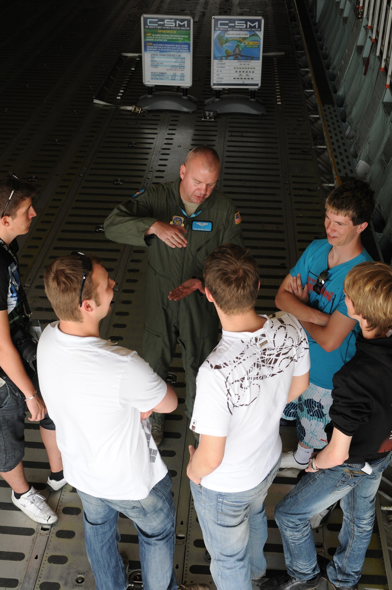 BERLIN -- Tech. Sgt. Michael Miska, 9th Airlift Squadron loadmaster, answers some of the questions of the visitors during the ILA 2010 Berlin International Aerospace Exhibition and Conferences Air Show June 8 at Berlin-Schoenefeld Airport. Sergeant Miska is from Dover Air Force Base, Del. (U.S. Air Force photo/Staff Sgt. Julius Delos Reyes)