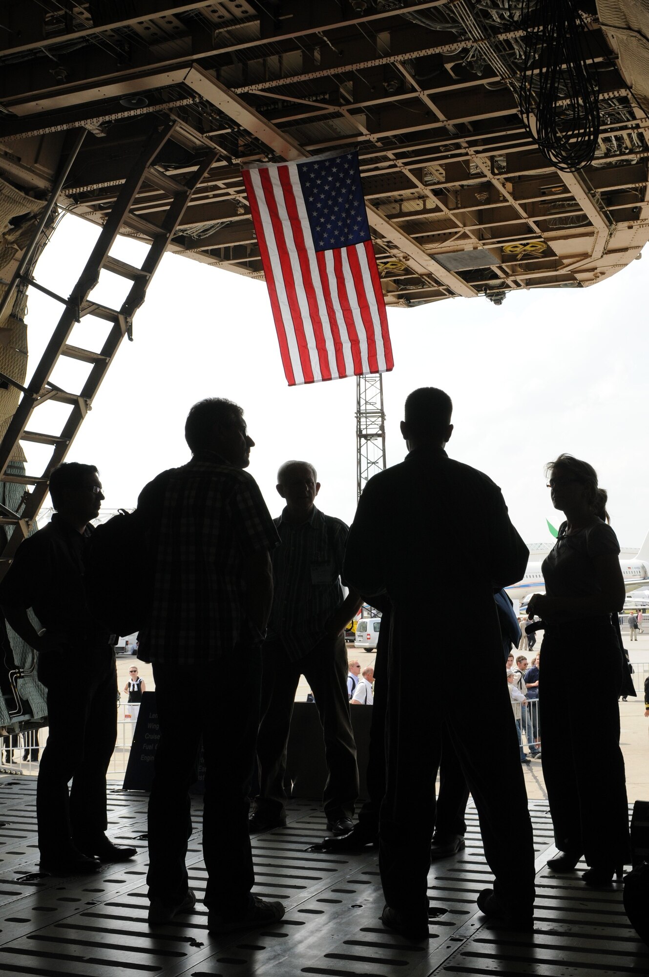 BERLIN -- An Airman with the 9th Airlift Squadron from Dover Air Force Base, Del., provides information about the C-5 Galaxy during the ILA 2010 Berlin International Aerospace Exhibition and Conferences Air Show June 8 at Berlin-Schoenefeld Airport. Approximately 90 U.S. military aircrew and support personnel from bases in Europe and continental U.S. are participating in the Berlin Air Show, one of the premier events of its type in the world. (U.S. Air Force photo/Staff Sgt. Julius Delos Reyes) 