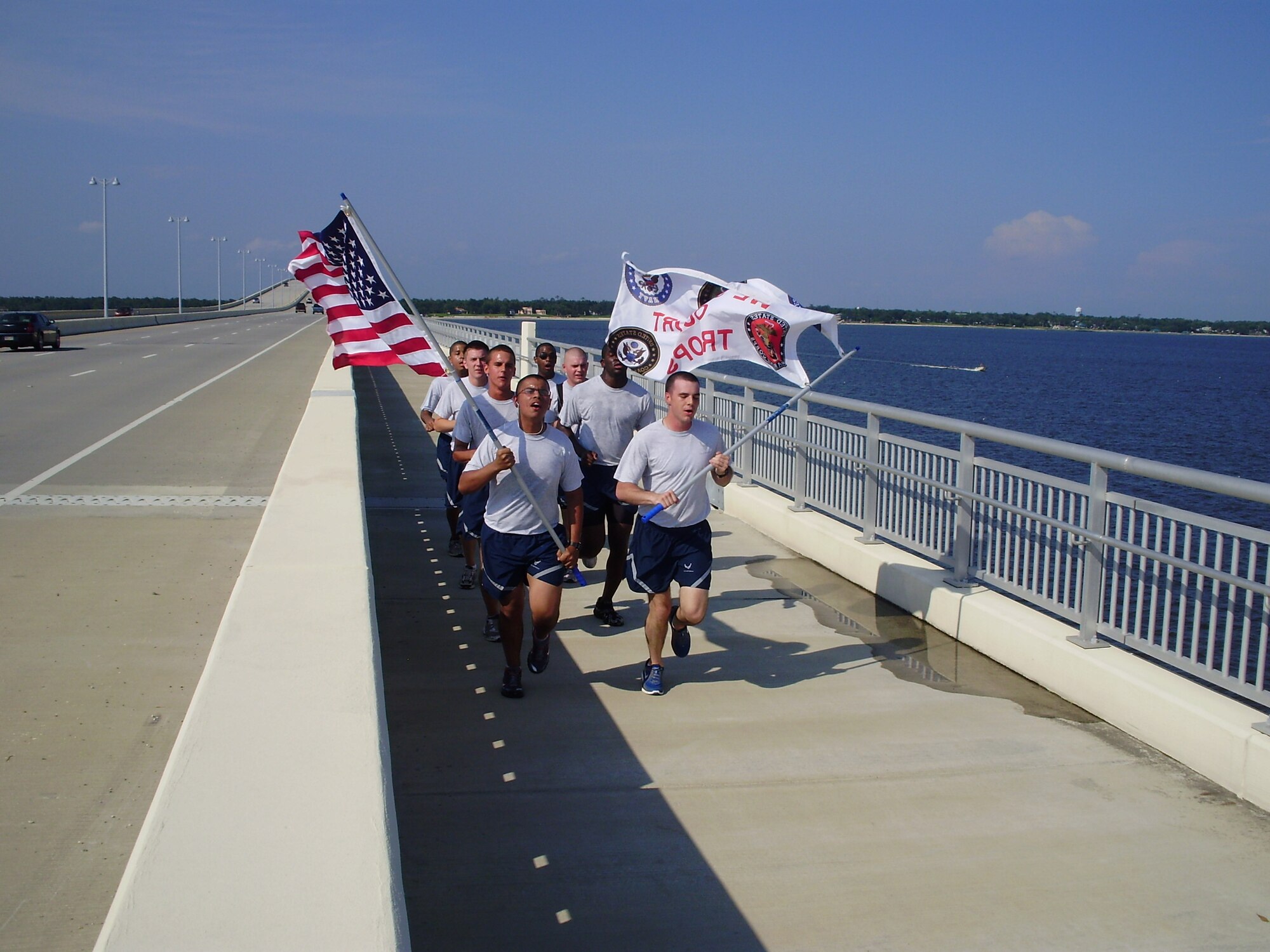 Eighteen students from the 336th Training Squadron and two cadets from Keesler’s Civil Air Patrol participated in the “Remember to Remember” Ernest Roy Jr. Memorial Day Flag Relay May 31.  The Keesler team took turns running the last 14 miles of the 134-mile relay carrying the Stars and Stripes and a Support Our Troops flag.  The runners pictured ran the 1.6 mile Ocean Springs Bridge during the hottest part of the day without stopping, according to Chaplain (Capt.) Eric Whitmore, training branch chaplain, who helped organize Keesler participation.  Keesler ended the relay with a memorial service to remember those who gave the ultimate sacrifice.  The flag carried by the team will be presented to a local family who lost a loved one in combat operations.  (Courtesy photo)