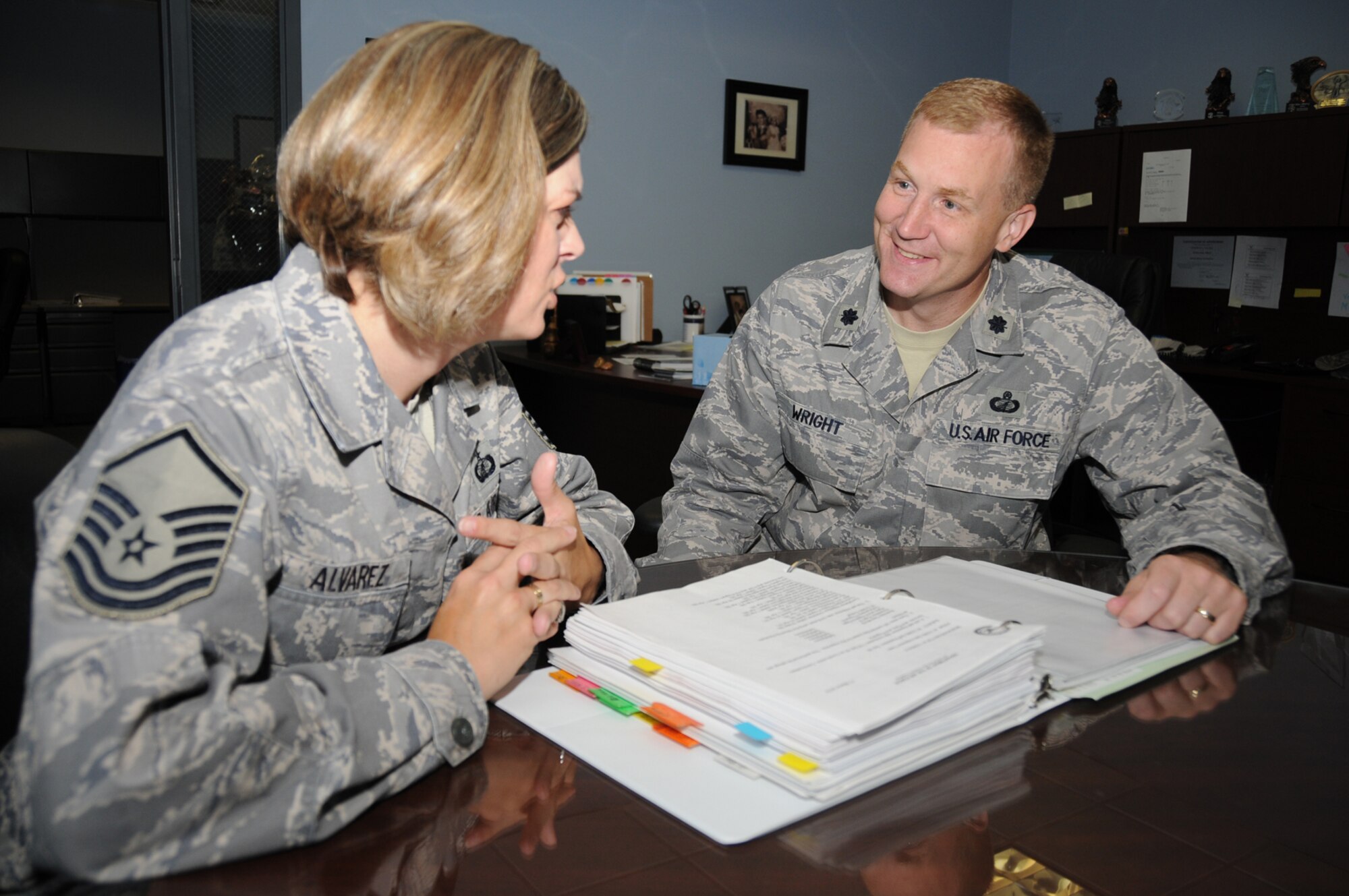Master Sgt. Kimberley Alvarez, left, 81st Contracting Squadron superintendent, goes over checklists with the squadron’s new commander, Lt. Col. Jonathan Wright, June 3.   The previous day, Colonel Wright assumed command from Lt. Col. Christopher Wegner, who led the unit since August 2007.  Colonel Wright came to Keesler from Pope Air Force Base, N.C., where he commanded the 43rd CONS.  Colonel Wegner is the new commander of the 633rd CONS at Langley AFB, Va.  (U.S. Air Force photo by Kemberly Groue)