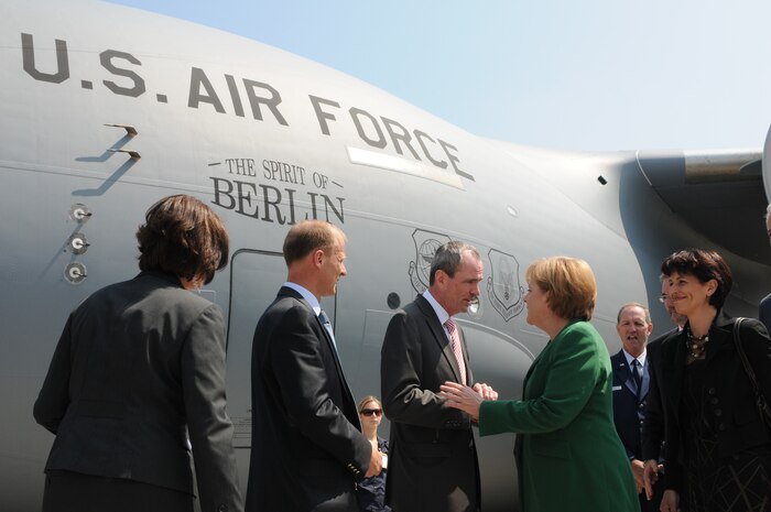 BERLIN -- Philip Murphy (left), U.S. Ambassador to the Federal Republic of Germany, talks to Federal Republic of Germany Chancellor Angela Merkel during the unveiling of the ILA 2010 Berlin International Aerospace Exhibition and Conferences Air Show June 8 at Berlin-Schoenefeld Airport. (U.S. Air Force photo/Staff Sgt. Julius Delos Reyes)