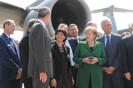 BERLIN -- Philip Murphy (left), U.S. Ambassador to the Federal Republic of Germany, talks to Federal Republic of Germany Chancellor Angela Merkel during the unveiling of the ILA 2010 Berlin International Aerospace Exhibition and Conferences Air Show June 8 at Berlin-Schoenefeld Airport. (U.S. Air Force photo/Staff Sgt. Julius Delos Reyes)
