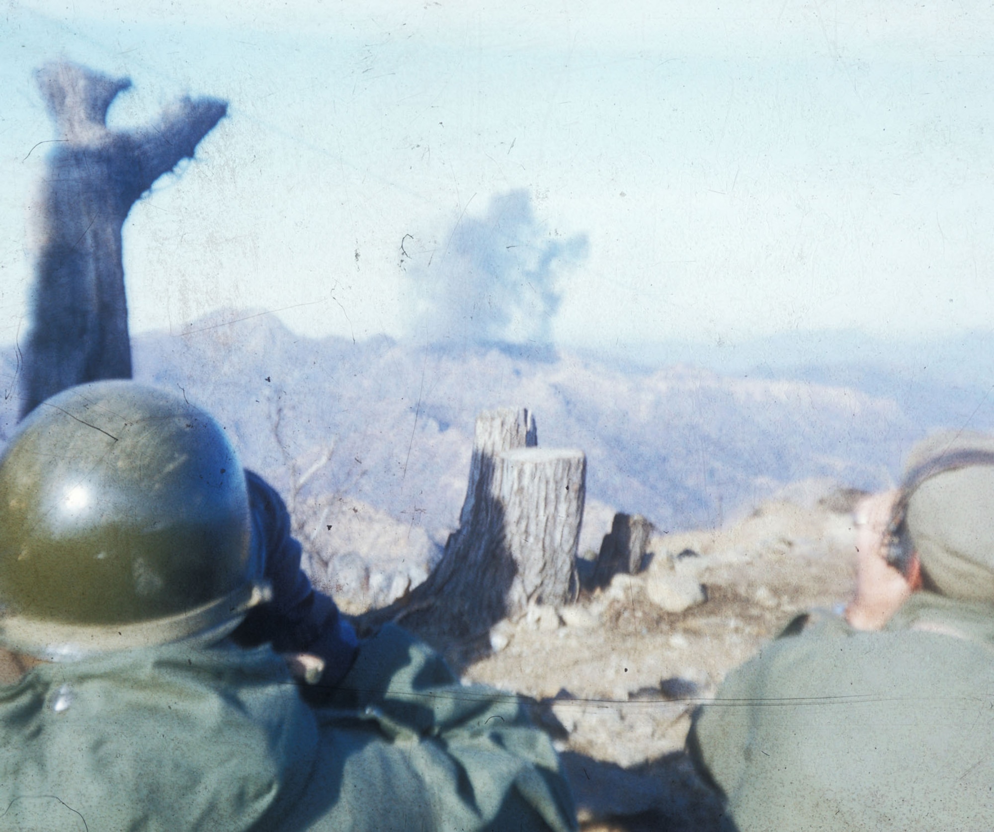 Lt. James Troublefield, a TACP forward air controller (on the right with headset and binoculars) is observing an airstrike he is directing in concert with an airborne T-6 Mosquito. (U.S. Air Force photo)