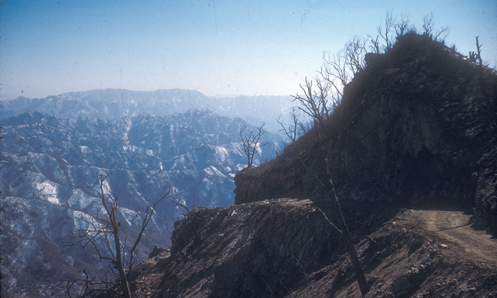 Precarious road on which TACP personnel drove their jeeps to reach the peak of Hill 1220 at the front. (U.S. Air Force photo)