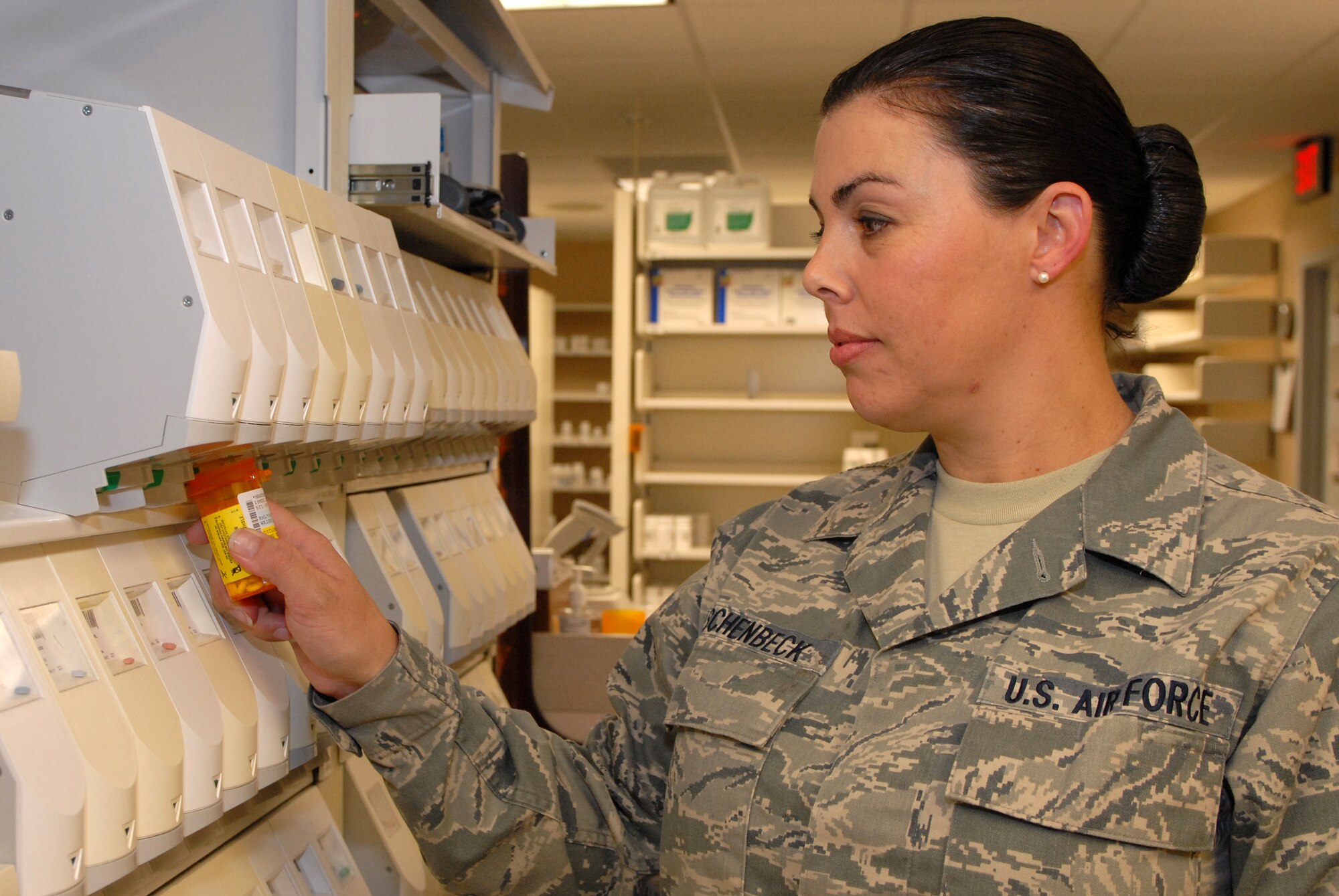 Master Sgt. Amber Aschenbeck, 19th Medical Support Squadron pharmacy flight chief, fills a prescription at the pharmacy June 4 on base. Sergeant Aschenbeck was vital to managing a pharmacy renovation that provides better customer service to patients seen at the 19th Medical Group. (U.S. Air Force photo by Senior Airman Steele C. G. Britton)