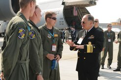 Vice Adm. Jeffrey Wieringa, Defense Security Cooperation Agency director, meets with Air Force aircrew during the ILA 2010 Berlin International Aerospace Exhibition and Conferences Air Show kickoff June 8 at Berlin-Schoenefeld Airport. The Berlin Air Show is one of the premier events of its type in the world. (U.S. Air Force photo/Staff Sgt. Julius Delos Reyes)