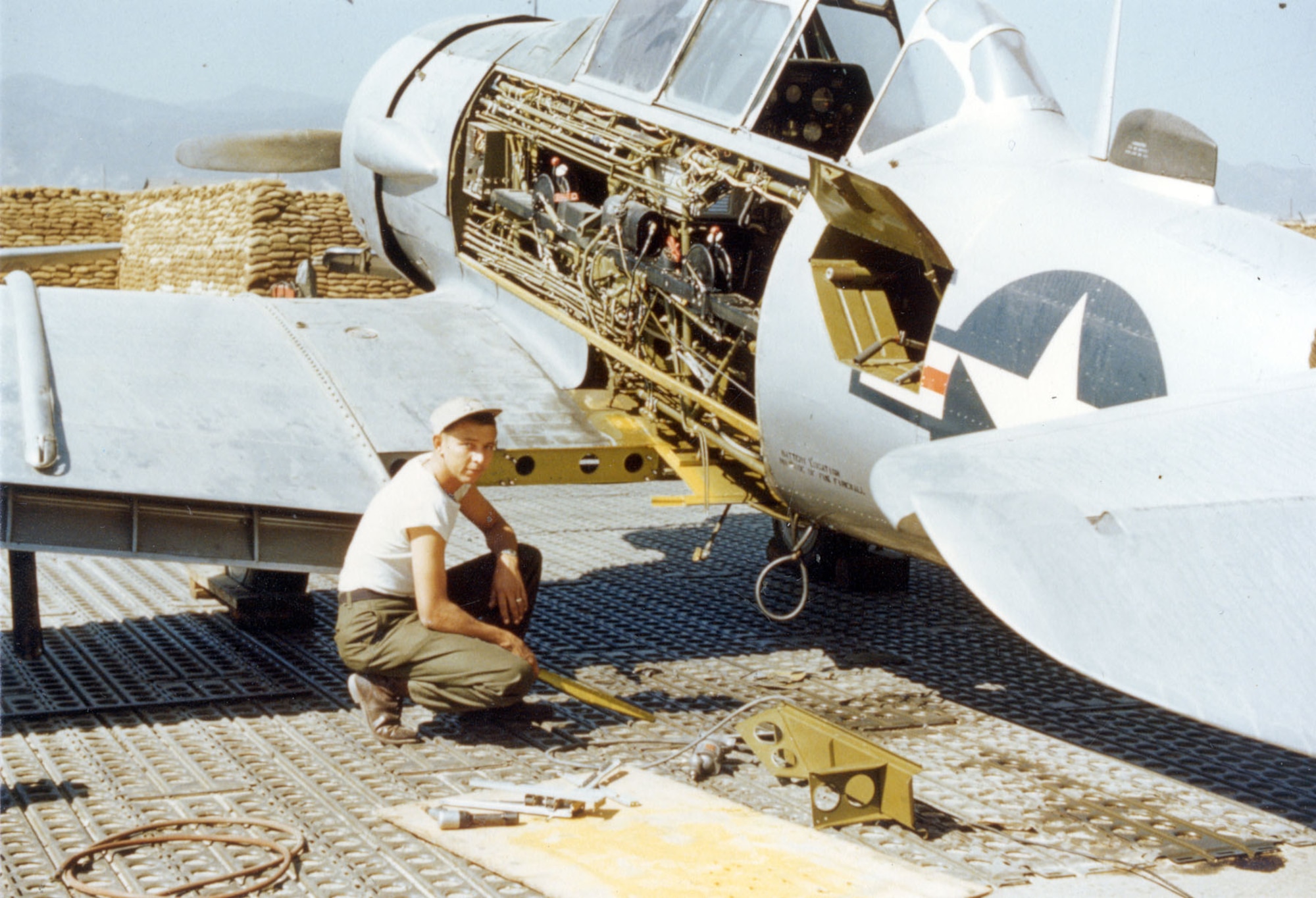 Ground crewman repairing the same damaged Mosquito LT-6D. (U.S. Air Force photo)