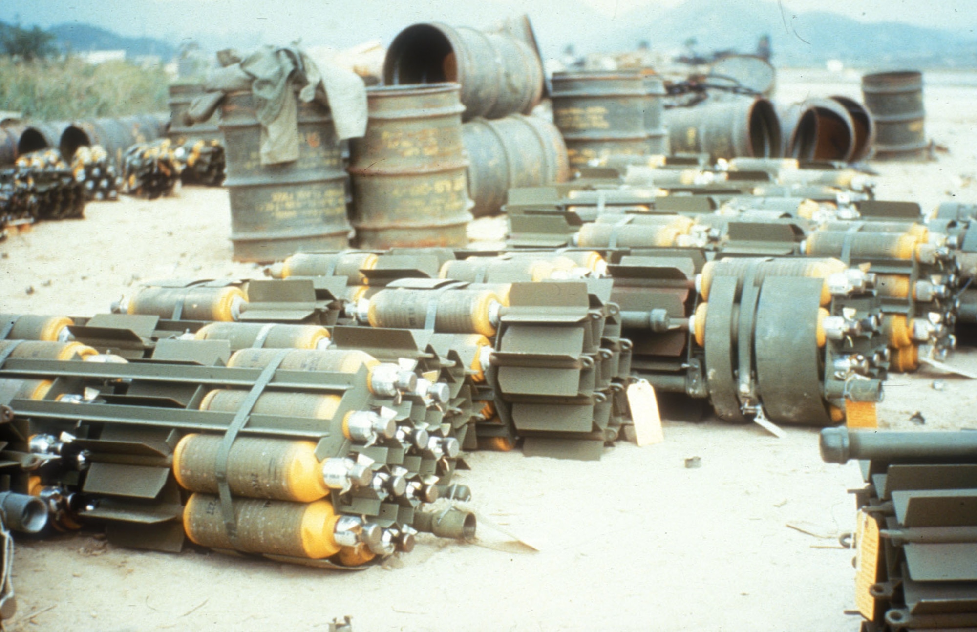 Bomb dump with several M26A1 bomb clusters. Each one scattered 20 20-lb. fragmentation bombs as it fell. This weapon was effective against enemy troops and trucks. (U.S. Air Force photo)