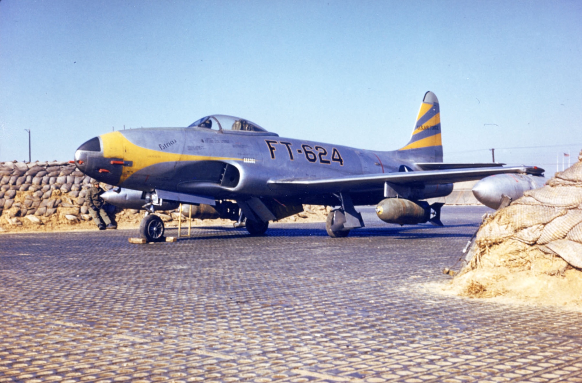 Mission-ready F-80C Shooting Star with two 1,000-lb. bombs and two large droppable fuel tanks. (U.S. Air Force photo)