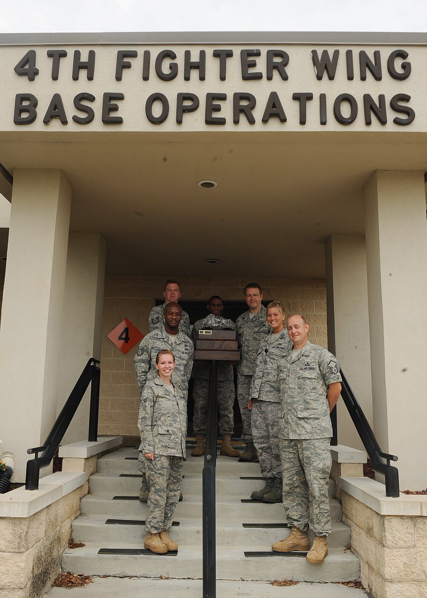 SEYMOUR JOHNSON AIR FORCE BASE, N.C. -- Members from the 4th Operations Support Squadron were recently recognized as the quarterly award winners for the facility recognition program here June 3, 2010. The winning unit receives $2,500 toward self-help projects and facility upgrades, and a travelling trophy. The program recognizes facilities that meet and exceed program standards. The intent of the initiative is to re-vitalize the Facility Manager Program and raise unit pride in maintaining a well-cared-for facility. (U.S. Air Force photo/Senior Airman Ciara Wymbs) 
