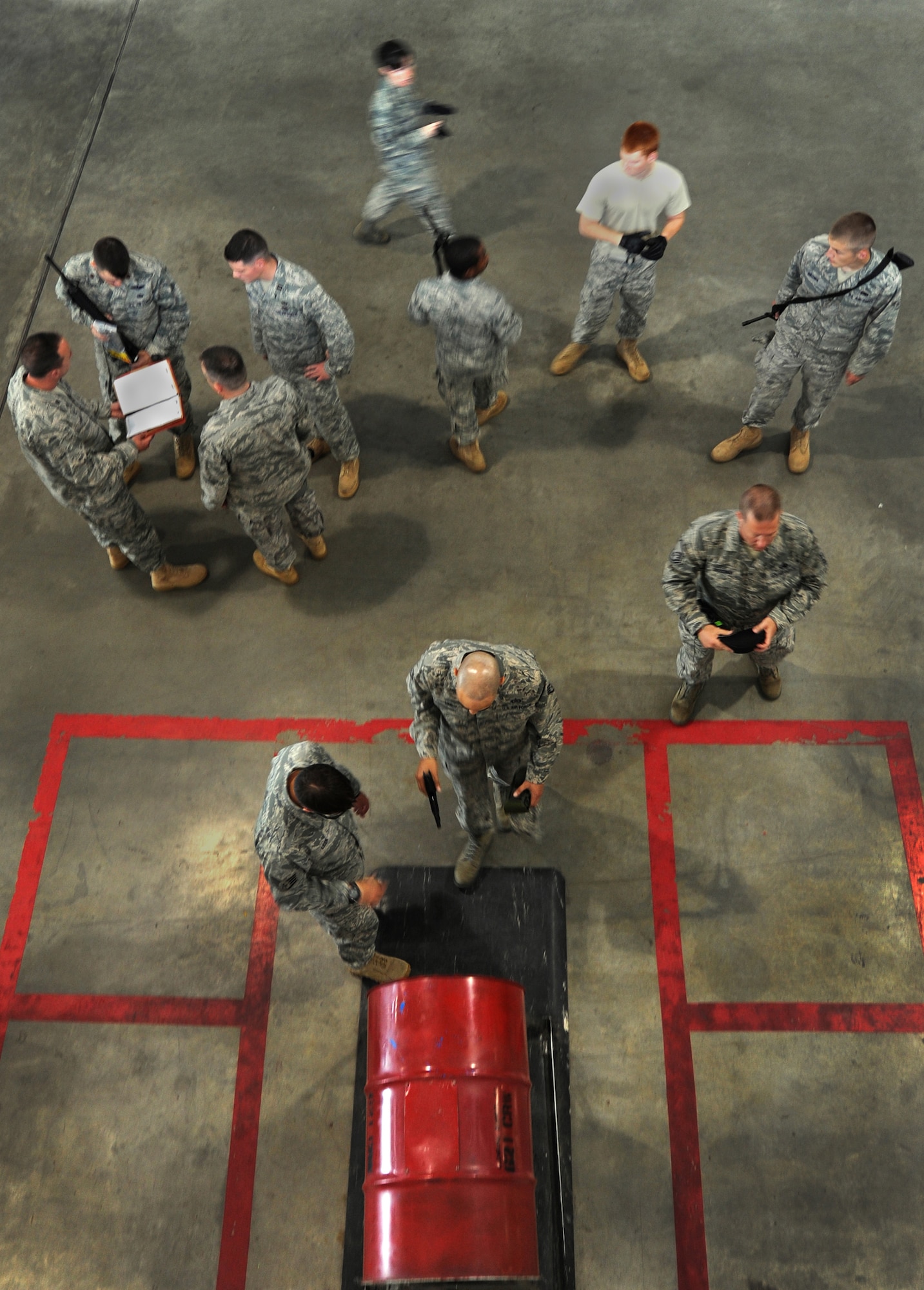 JOINT BASE MCGUIRE-DIX-LAKEHURST, N.J. – An Airman assigned to the 621st Contingency Response Wing steps forward to clear his issued sidearm in preparation for his deployment to Afghanistan June 2, at the 621 CRW’s Global Reach Deployment Center here.  The team of air mobility experts will be providing specialized cargo support in support of Operation Enduring Freedom. (U.S. Air Force photo/Tech. Sgt. Parker Gyokeres/released)