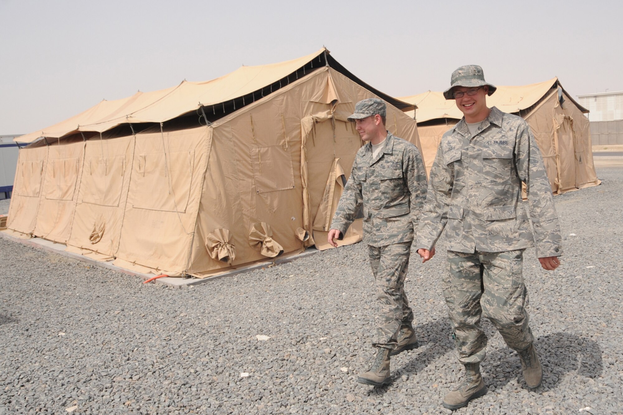 Air Force Academy seniors, Cadet 1st Class Eric Varner (left) and Cadet 1st Class Alan Foote (right), visit the 380th Air Expeditionary Wing at an undisclosed location in Southwest Asia as part of their summer deployed operatons program. They deploy to operatoinal wings in the theater to learn about current operations and further develop their leadership abilities. (U.S. Air Force photo/Senior Airman Jenifer H. Calhoun/Released)