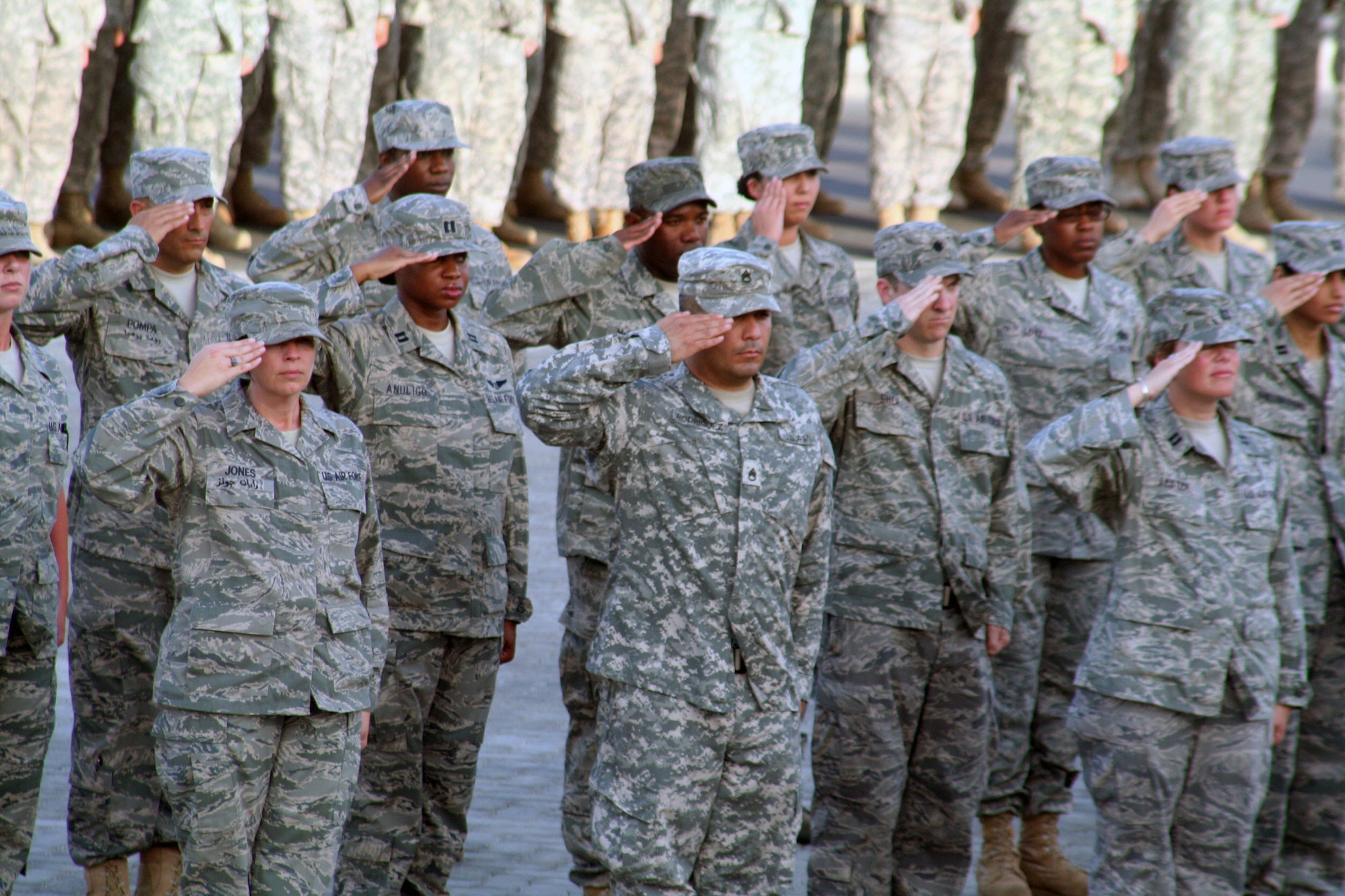 Airmen from the 380th Air Expeditionary Wing participate in a wing retreat ceremony on May 28, 2010, at a non-disclosed base in Southwest Asia. Every week the 380th AEW holds a retreat ceremony honoring the American flag as part of a continuing military tradition. On May 28, the 380th Expeditionary Medical Group served as the lead unit for the retreat. The 380th AEW supports operations Iraqi Freedom and Enduring Freedom and the Combined Joint Task Force-Horn of Africa. (U.S. Air Force Photo/Master Sgt. Scott T. Sturkol/Released)