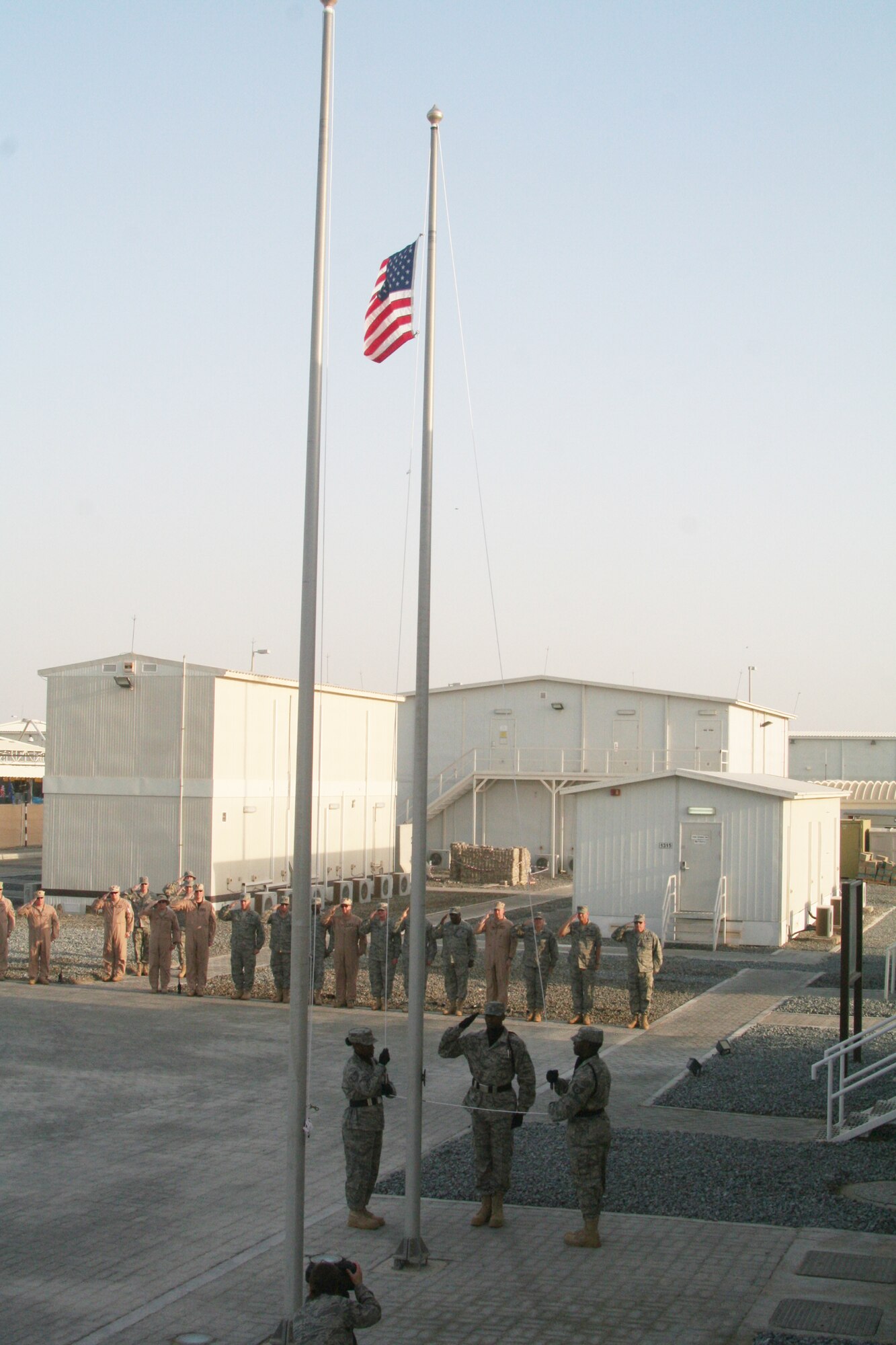 Airmen from the 380th Air Expeditionary Wing participate in a wing retreat ceremony on May 28, 2010, at a non-disclosed base in Southwest Asia. Every week the 380th AEW holds a retreat ceremony honoring the American flag as part of a continuing military tradition. On May 28, the 380th Expeditionary Medical Group served as the lead unit for the retreat. The 380th AEW supports operations Iraqi Freedom and Enduring Freedom and the Combined Joint Task Force-Horn of Africa. (U.S. Air Force Photo/Master Sgt. Scott T. Sturkol/Released)