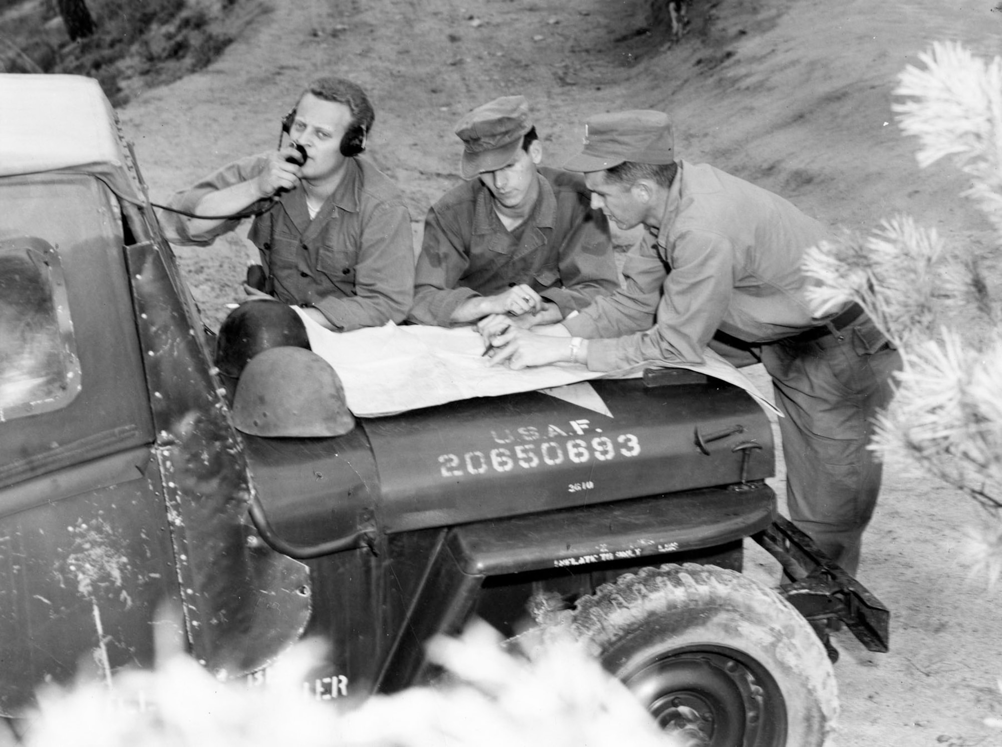 Tactical Air Control Party communicating with an airborne Mosquito FAC. (U.S. Air Force photo)