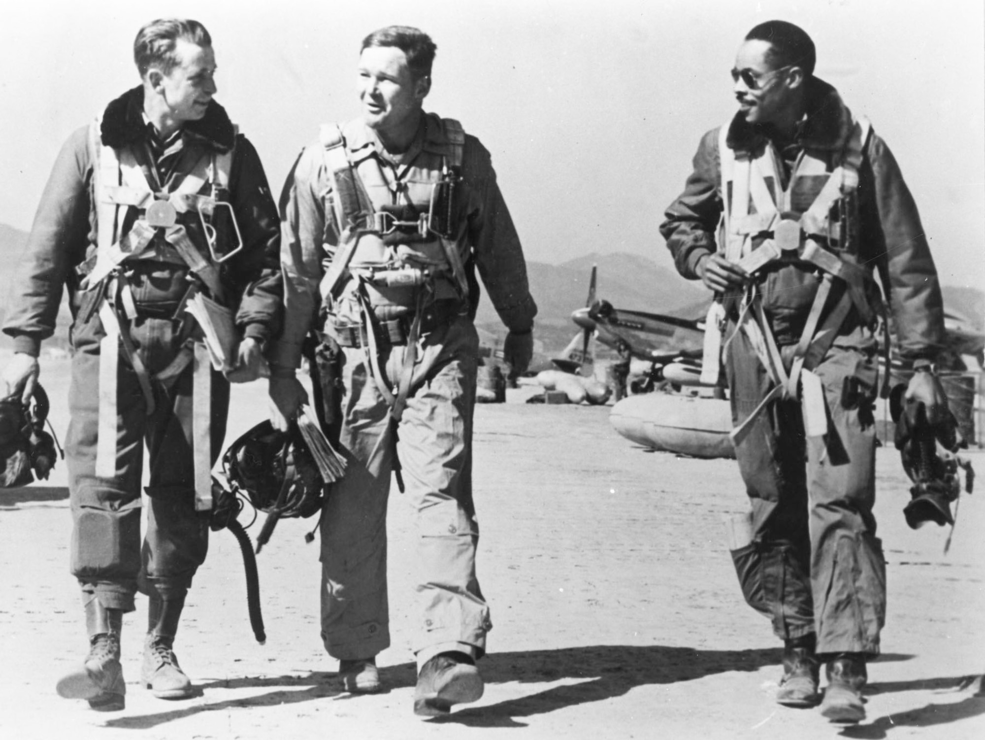 F-51 pilots returning from a mission. (Left to right) 1st Lt. George McKee, Capt. Samuel Sanders and Capt. Leroy Roberts, a former Tuskegee Airman. (U.S. Air Force photo)
