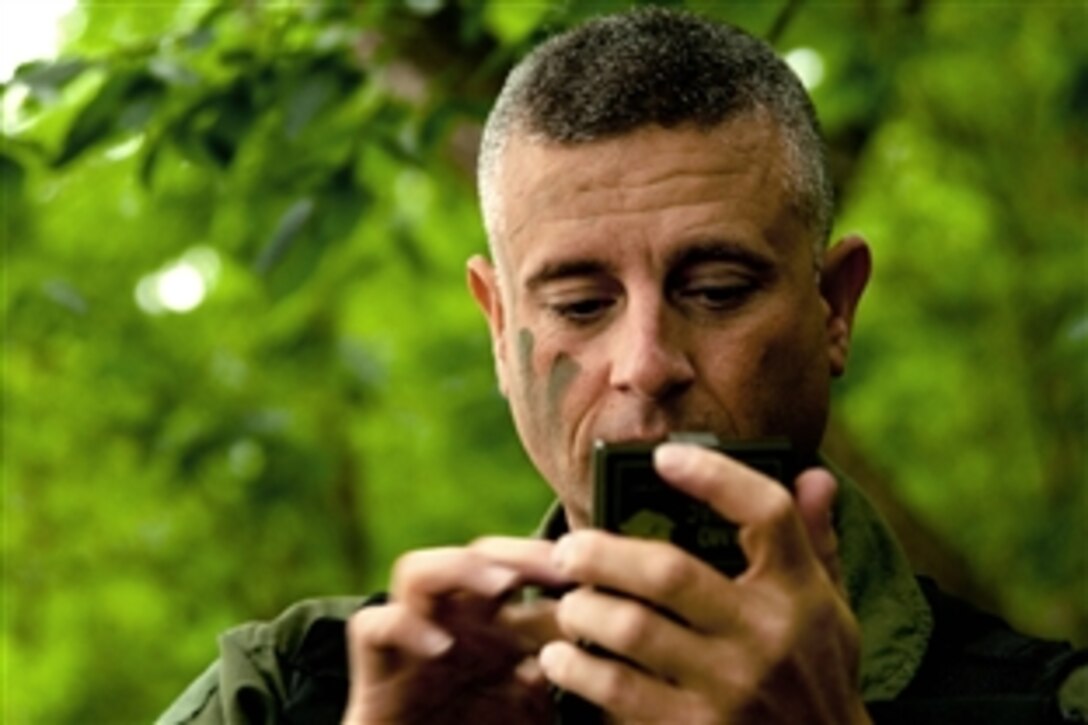 A U.S. Air Force pilot camouflages his face during survival training in Missouri, June 5, 2010. He and his fellow pilots are assigned to the 180th Airlift Squadron, 139th Airlift Wing, based in St. Joseph, Mo.