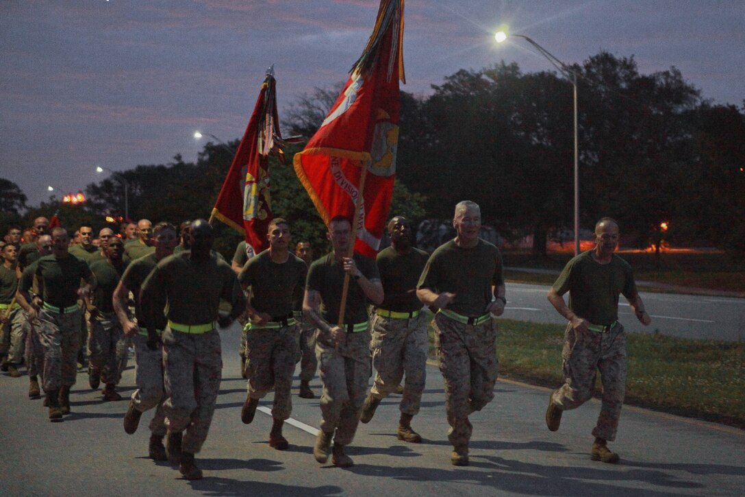 Senior leaders run alongside Maj. Gen. John A. Toolan, commanding general of 2nd Marine Division, as he leads approximately 16,000 Marines within the Division on a morning run aboard Marine Corps Base Camp Lejeune, April 20. Afterward, Toolan adressed the crowd of Marines, thanking them for their hard work and citing Marines of history before dismissing them for the weekend.(Official U.S. Marine Corps photo by Cpl. Walter Marino)