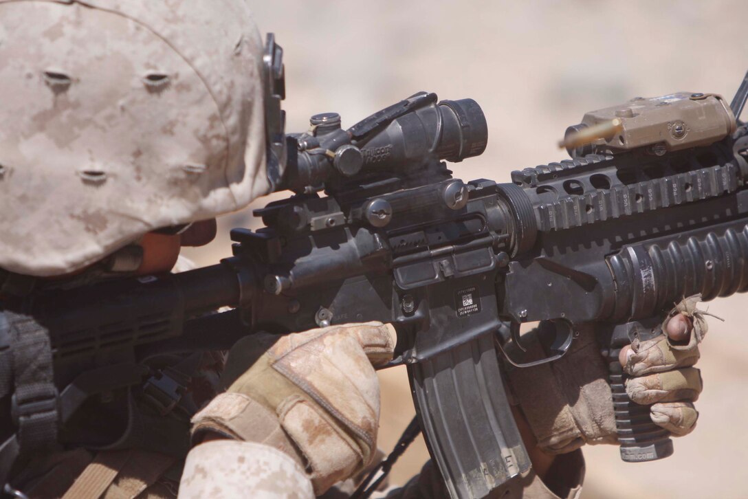 Lance Cpl. Cory Bell, a scout with Company D, 3rd Light Armored Reconnaissance Battalion, picks off targets at Combat Center Range 410 June 10. The scouts were given support from their light armored vehicles when running the range.::r::::n::