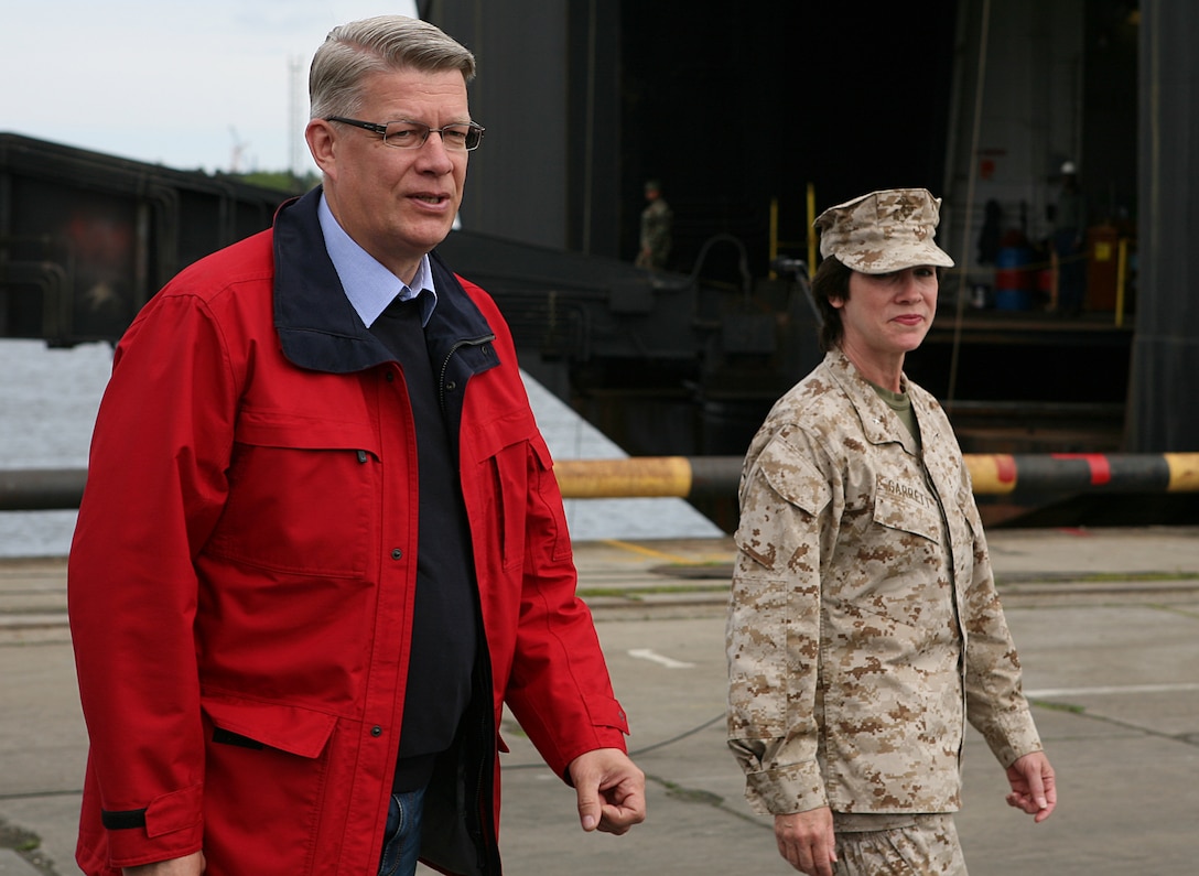 Latvian President Valdis Zatlers (left) walks with Maj. Gen. (sel.) Tracy L. Garrett, commanding general of the 4th Marine Logistics Group, prior to a distinguished visitor event at several sites around the exercise Baltic Operations 2010 training areas. Since the start the exercise on June 6th, the Marines and Sailors of 4th Landing Support Battalion and Naval Beach Group 2 have been working with members of the Armed Forces of Latvia to conduct maritime preposition force offload operations here.