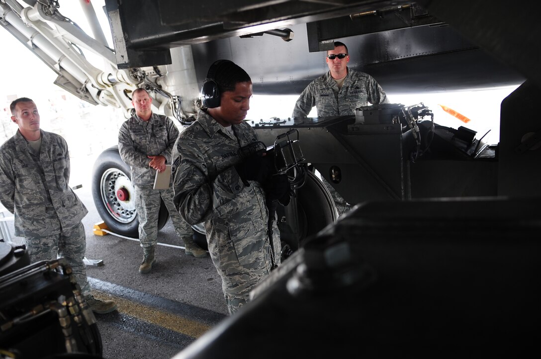 ELLSWORTH AIR FORCE BASE S.D. -  Senior Airman Tavares Battle, 28th Aircraft Maintenance Squadron load crew member, uses a power control unit to raise the conventional rotary launcher on a munitions handling unit during the Global Strike Challenge, June 9. The Global Strike Challenge evaluated 28th Bomb Wing competing members on their skills and knowledge of their work. (U.S. Air Force photo/Airman 1st Class Corey Hook)
