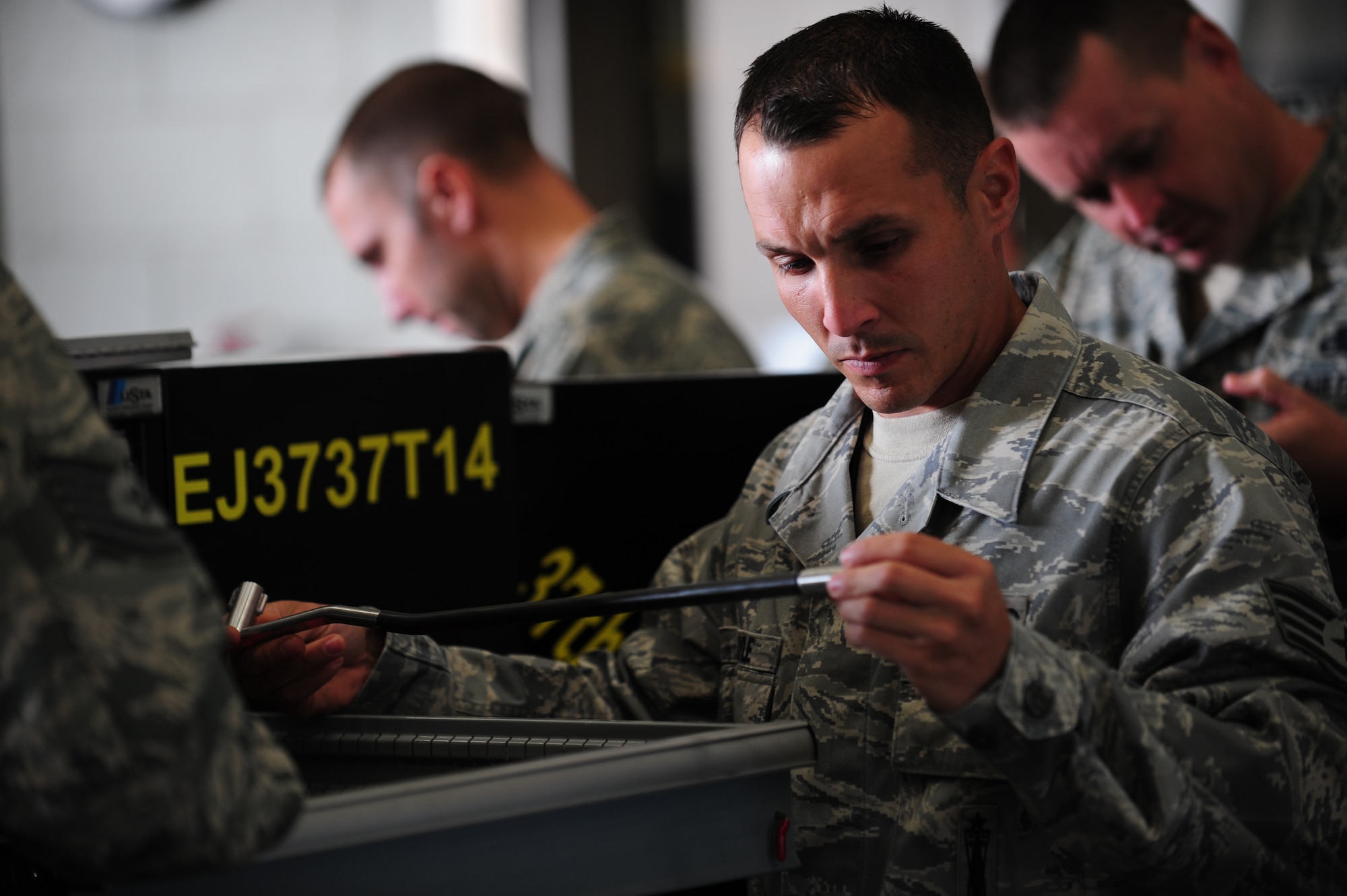 ELLSWORTH AIR FORCE BASE S.D. -  Global Strike Challenge inspector Staff Sgt. Michael Lyle examines a lock and lock tool during the Global Strike Challenge, June 9. Sergeant Lyle is assigned to the 2nd Maintenance Squadron on Barksdale AFB, La. as a loading centralization crew member. Examining tools during the composite tool kit inspection is just one of six portions evaluated by Global Strike Challenge inspectors. (U.S. Air Force photo/Airman 1st Class Corey Hook)