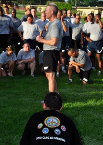 Colonel Gregory Reilly, Joint Task Force-Bravo Commander, talks to members of Soto Cano Air Base, Honduras June 9 after the monthly JTF-B run. Colonel Reilly applauded JTF-B's recent successes, including the return from Haiti, counter-narcotic tracking efforts and disaster relief support to the people of Guatemala. (U.S. Air Force photo by Staff Sgt. Bryan Franks)