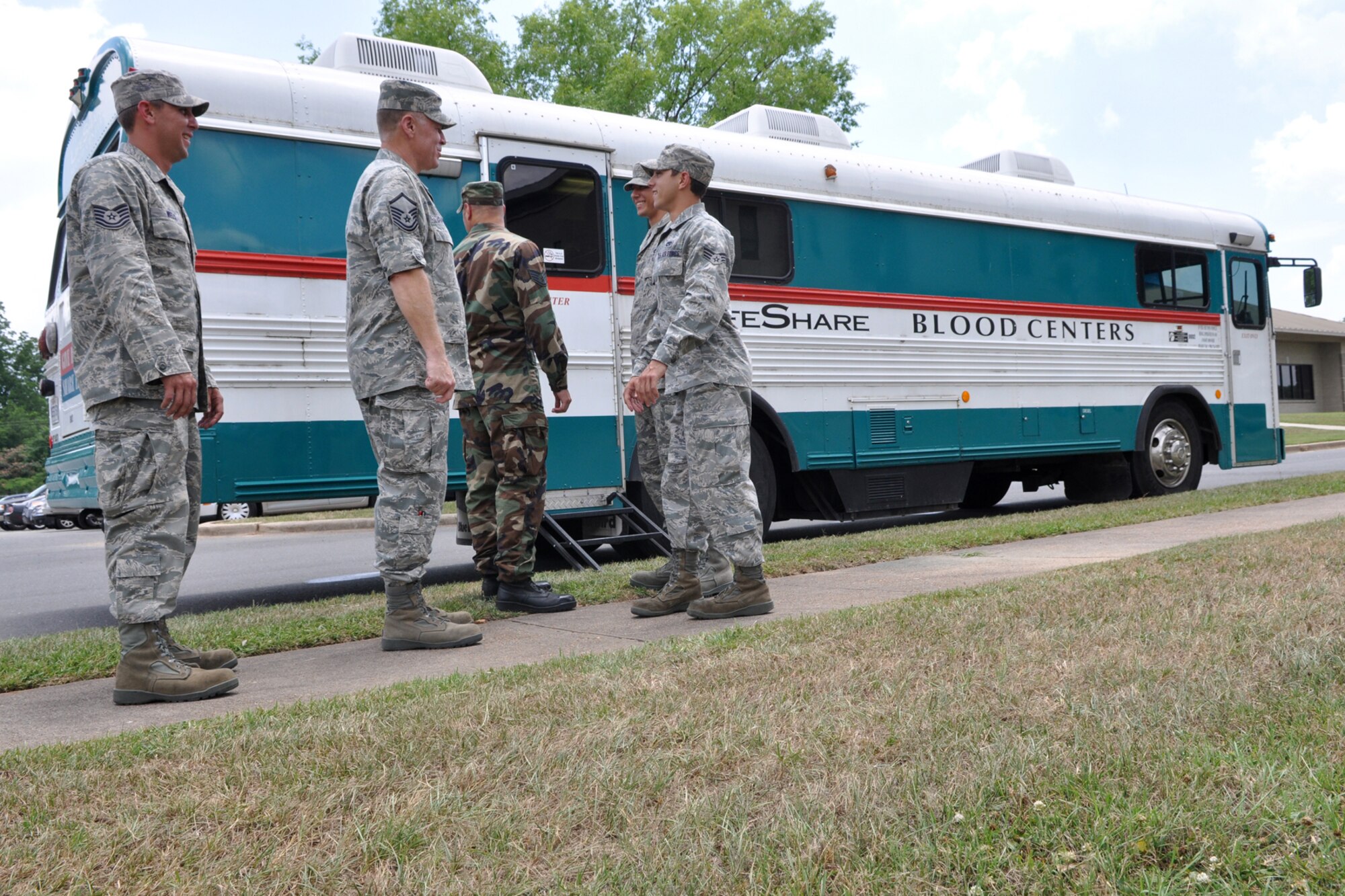 Airmen from the 917th Wing wait their turn to donate blood outside a LifeShare Blood Centers’ donor bus during the 917th Wing Blood Drive in the course of the Unit Training Assembly weekend at Barksdale Air Force Base, La., June 5, 2010. The mission of Life Blood Centers is to provide quality blood, blood components and related services for use by patients on an efficient cost effective basis. According to Gwen Herndon from LifeShare, 18 units were donated by 917th Airmen, and that was three more than the projected goal of fifteen. The 917th Wing takes pride in supporting the community in which they serve by donating blood. The next 917th Wing Blood Drive is scheduled for Saturday, August 7, 2010, from during the August UTA.  Together, we save lives! For information about donating blood to assist your community or family, contact: www.lifesharedonorclub.org or www.lifeshare.org. (U.S. Air Force photo / Senior Airman Crystal Jordan)