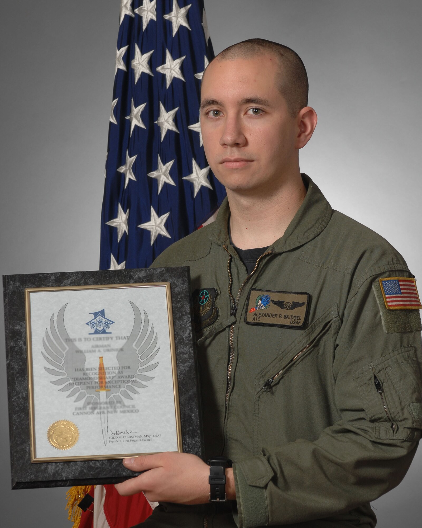 Airman First Class Alexander Skidgel, 16th Special Operations Squadron, displays his Diamond Sharp award he received May 28.The Diamond Sharp awards are sponsored by the wing's first sergeants and recognize individuals who display a positive "can do? attitude" and present a sterling military image at all times.  (U.S. Air Force photo by Senior Airman Evelyn Chavez) 
