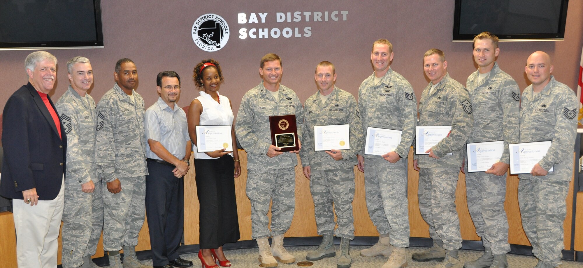 Tyndall Air Force Base members pose with their certification of appreciation for their involvement in the Bay County School Mentor Program June 10.  (U.S. Air Force photo by Senior Airman Anthony J. Hyatt)