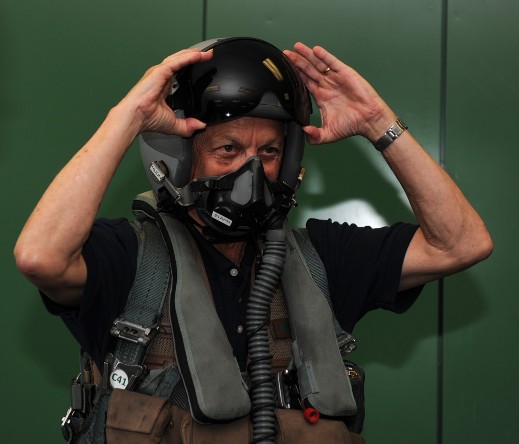 SEYMOUR JOHNSON AIR FORCE BASE, N.C. -- Retired Brig. Gen. Dan Cherry lowers his visor after suiting up in life support here June 4, 2010. General Cherry invited the base to share his unique story of befriending the former Vietnamese pilot he shot down during the Vietnam War. General Cherry hails from Bowling Green, Ky. (U.S Air Force photo/Senior Airman Gino Reyes)