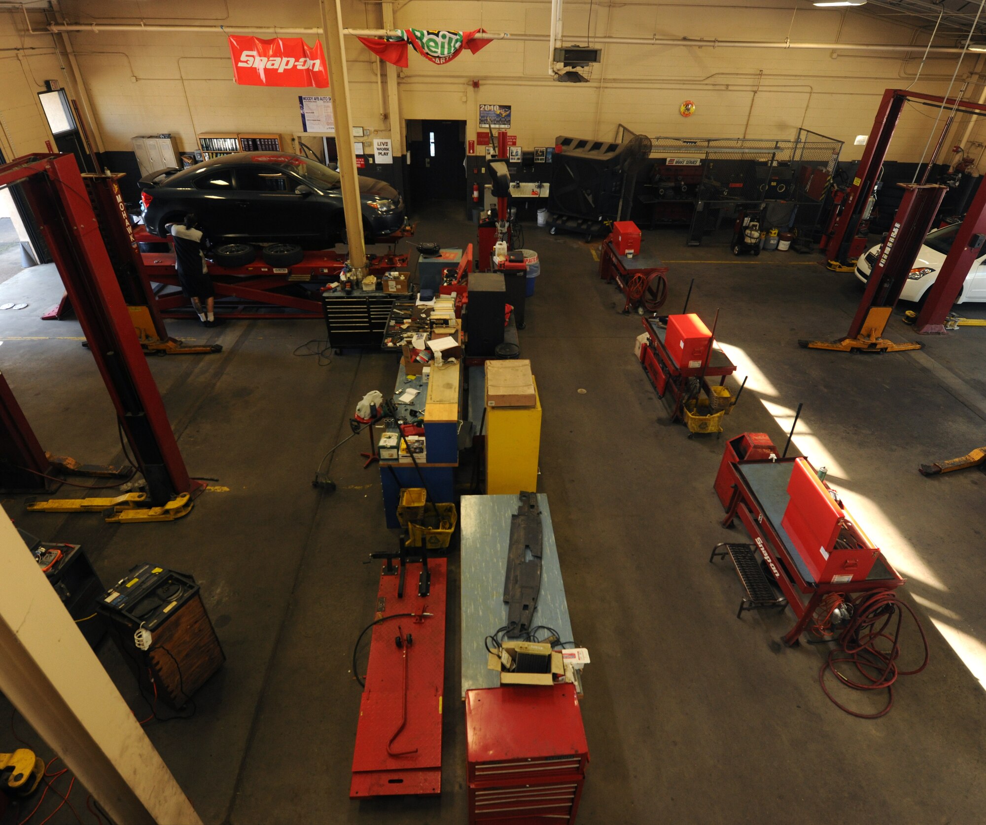 MOODY AIR FORCE BASE, Ga. -- The Auto Skillz Center provides nine different stations for vehicle maintenance. Each station comes with its own vehicle lift, tools and personal safety equipment for members to use while making automotive repairs to their vehicle. (U.S. Air Force photo by Airman 1st Class Benjamin Wiseman/RELEASED)