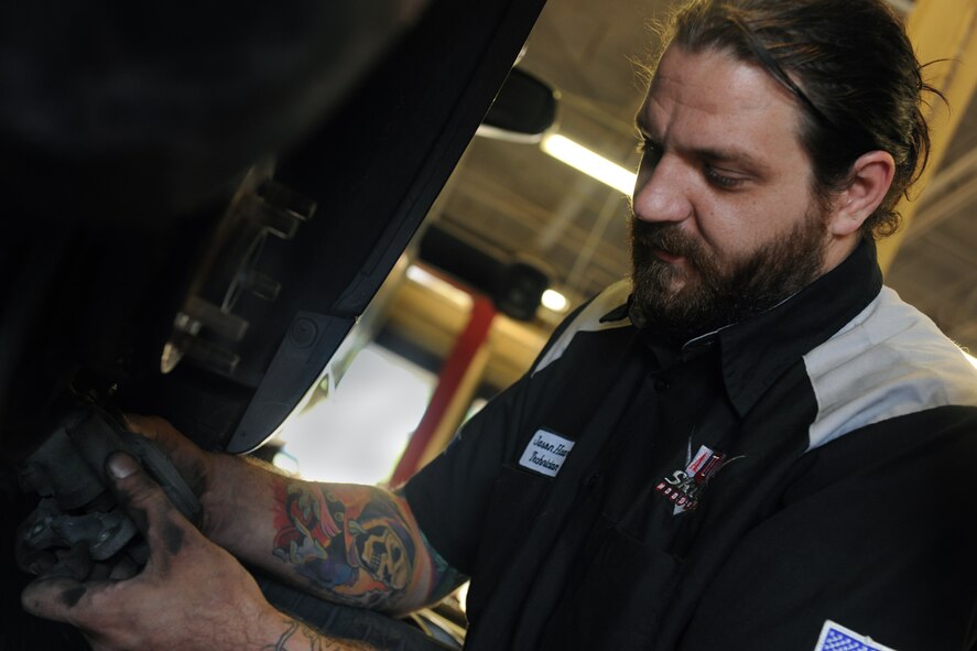 MOODY AIR FORCE BASE, Ga. --Jason Huard, Auto Skillz Center automotive technician, replaces the brakes on a vehicle here May 26. The Auto Skillz Center has six people on staff that can assist members with anything from finding a certain tool to help with the repairing of vehicles. (U.S. Air Force photo by Airman 1st Class Benjamin Wiseman/RELEASED) 