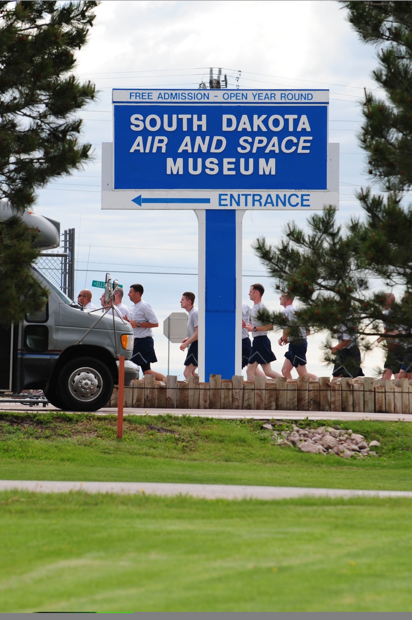 Members of the 28th Munitions Squadron run from the Civil Engineer football field to the South Dakota Air and Space Museum to clean a B-29 Superfortress static display, June 4. Along with the 28th Munitions Squadron, other squadrons from the 28th Bomb Wing maintain an “adopted plane.”  (U.S. Air Force photo/Airman 1st Class Corey Hook)
