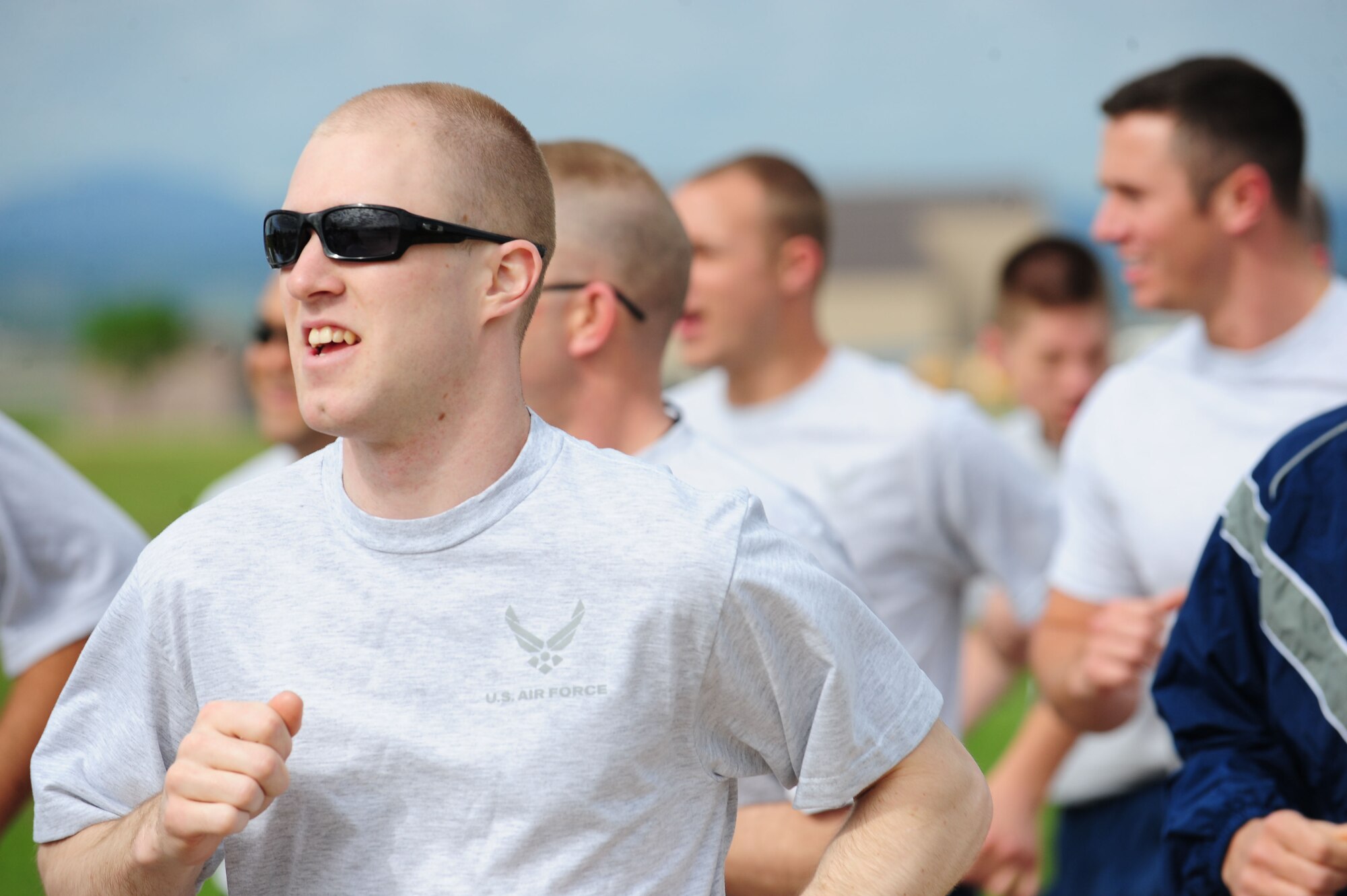 ELLSWORTH AIR FORCE BASE S.D. -- Senior Airman Jonathon Hill, 28th Munitions Squadron weapons armament member, runs from the Civil Engineer football field to the South Dakota Air and Space Museum, June 4.  Both physical fitness and cleaning were incorporated collectively by members of the 28th Munitions Squadron. (U.S. Air Force photo/Airman 1st Class Corey Hook)