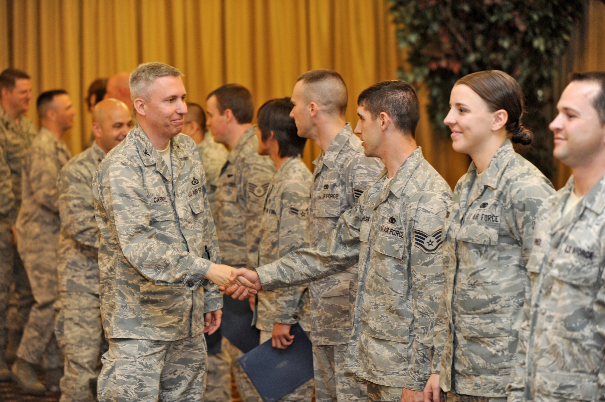 Col. Michael Carrell, 87th Mission Support Group commander, congratulates Joint Base McGuire-Dix-Lakehurst Honor Guard team members after a graduation ceremony here. The JB MDL Honor Guard went through a refresher training course conducted by the U.S. Air Force Honor Guard May 24 through June 2. (U.S. Air Force photo/Carlos Cintron)