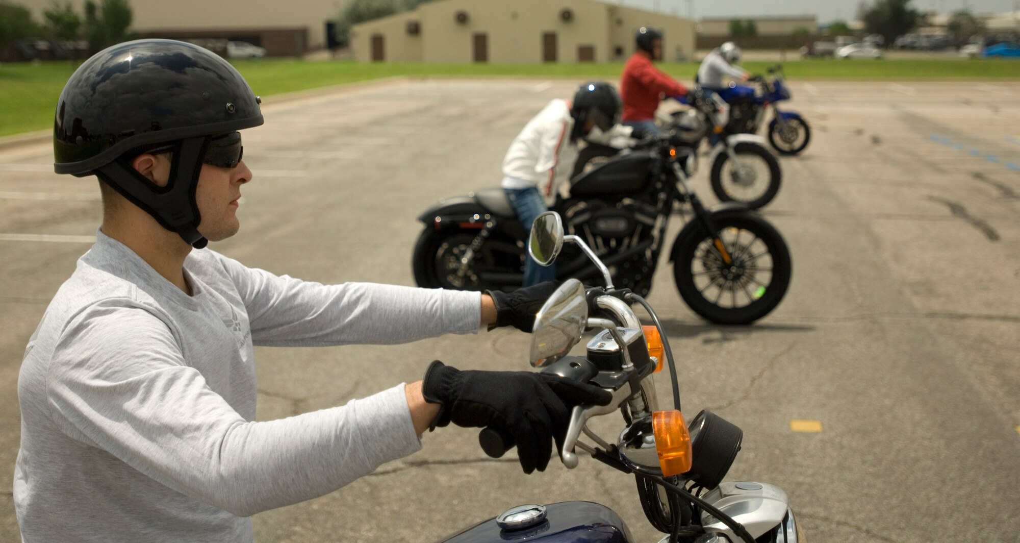 Senior Airman Nathaniel Bush, 22nd Logistic Readiness Squadron fuel services center controller, listens as course leaders offer instruction motorcycle on the first day of the Beginner Rider Course June 10, 2010, McConnell Air Force Base. Motorcycle safety is an integral part of the Air Force’s Critical Days of Summer program. McConnell offers its more than 245 riders three classes, depending on their level of expertise. (U.S. Air Force photo/Airman Armando A. Schwier-Morales)
