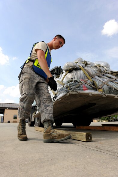 SEYMOUR JOHNSON AIR FORCE BASE, N.C. -- Airman 1st Class David Rankin positions dunnage for the delivery of palletized cargo here June 8, 2010. Dunnage is scrap wood used to support or protect cargo during storage or shipment. Assigned to the 4th Component Maintenance Squadron, Airman Rankin is primarily a fuels maintainer but this is his second exercise as an augmentee. He hails from Waterford, Ohio.  (U.S. Air Force photo/1st Lt. Matt Schroff)