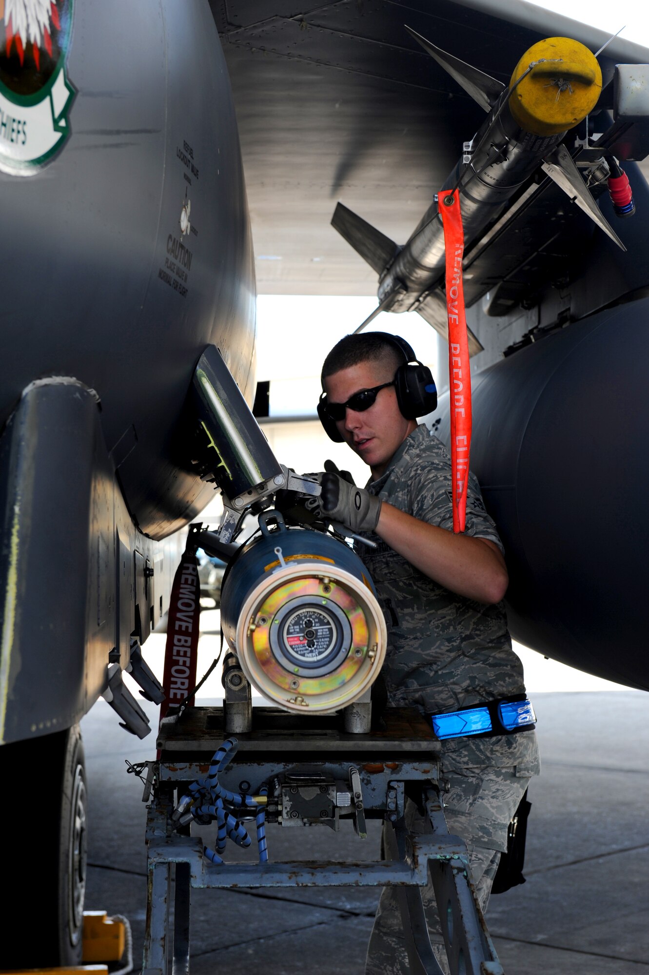 SEYMOUR JOHNSON AIR FORCE BASE, N.C. -- Senior Airman Cody Jurgensmeyer prepares to attach a GBU-12 munition to the conformal fuel tank rack on an F-15E Strike Eagle here June 8, 2010. During the Phase I Operational Readiness Exercise, aircraft generated for deployment flew a normal sortie, and were sent to a separate area of the parking ramp to simulate arrival at a deployed location. As part of the regeneration effort, Airman Jurgensmeyer led a three-person load team to quickly arm the aircraft for its next sortie. Airman Jurgensmeyer, a load crew team chief from the 334th Aircraft Maintenance Unit, hails from Montrose, Mo.  (U.S. Air Force photo/1st Lt. Matt Schroff)