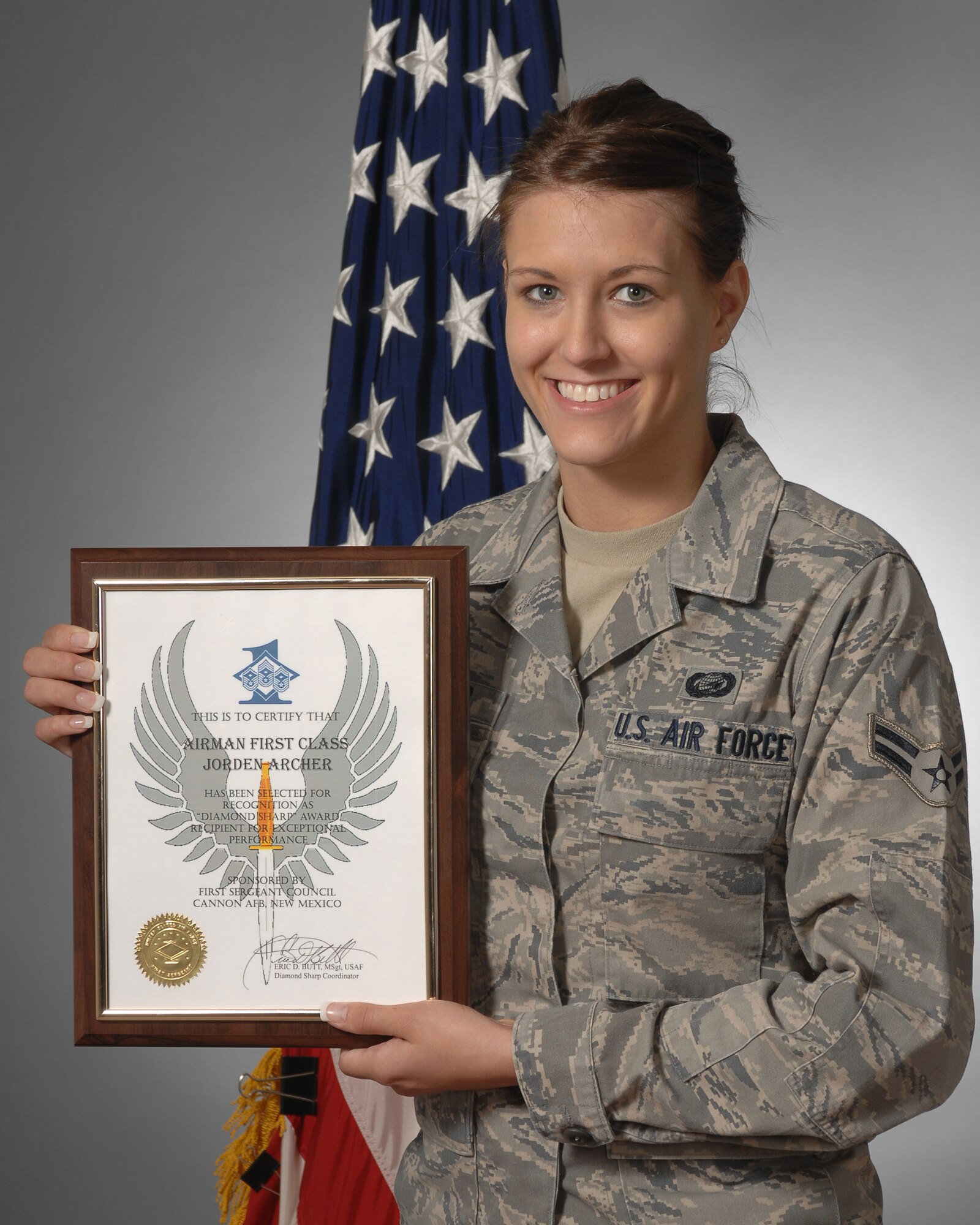 Airman First Class Jorden Archer, 27th Special Operations Force Support Squadron, displays the Diamond Sharp Award she recieved for May.The award is presented monthly and recognizes Airmen who exemplify professionalism both on and off duty.  (U.S. Air Force photo by Airman First Class Maynelinne De La Cruz) 
