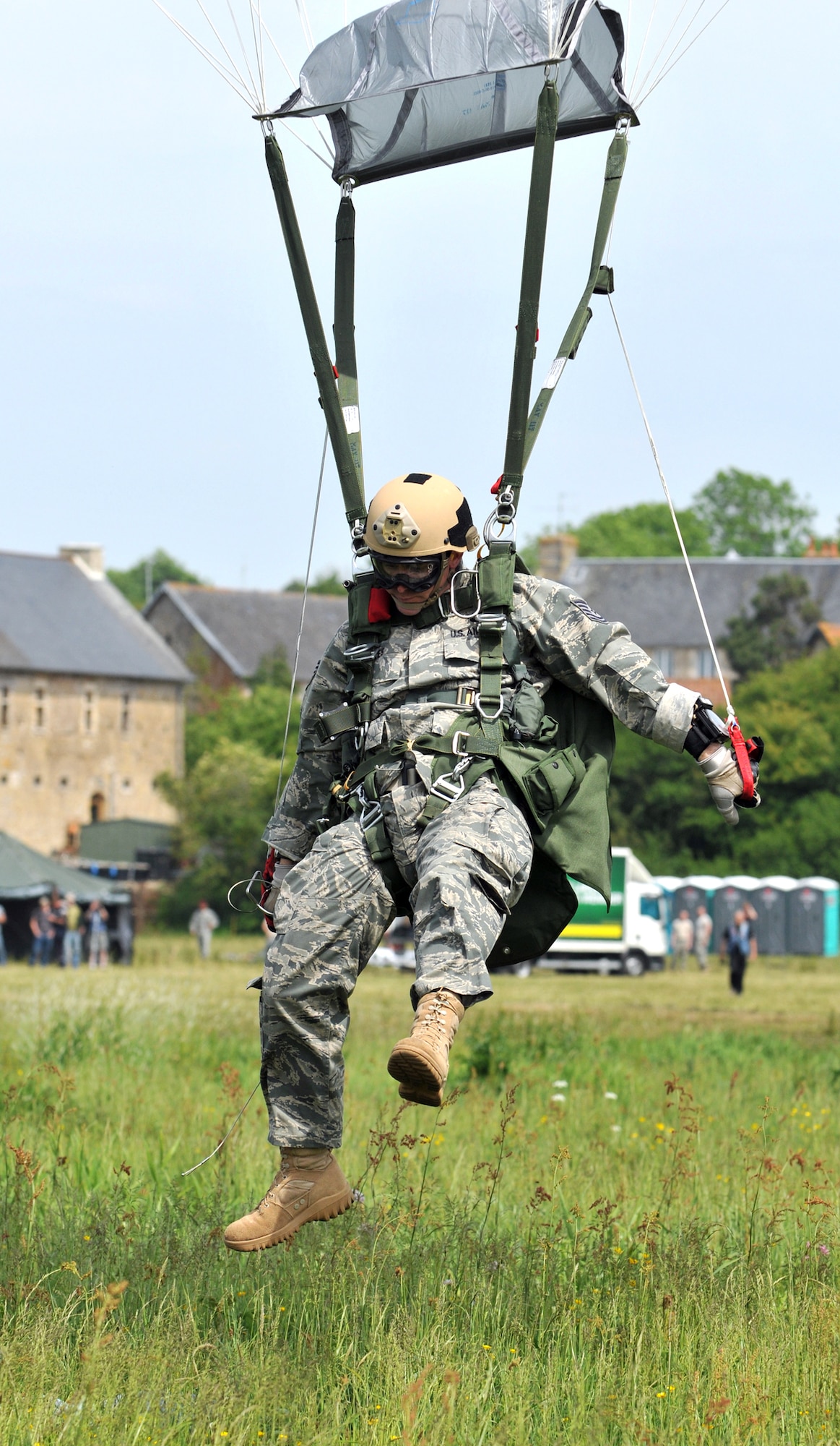 A member of the 321st Special Tactics Squadron lands June 5, 2010, in the "Iron Mike" drop zone in Normandy, France, where the Allies first landed in the D-Day invasion of World War II. The high-altitude, low-opening jump was part of a ceremony commemorating the 66th anniversary of D-Day. The 321st STS is from RAF Mildenhall, England. (U.S. Air Force photo/Staff Sgt. Austin M. May)