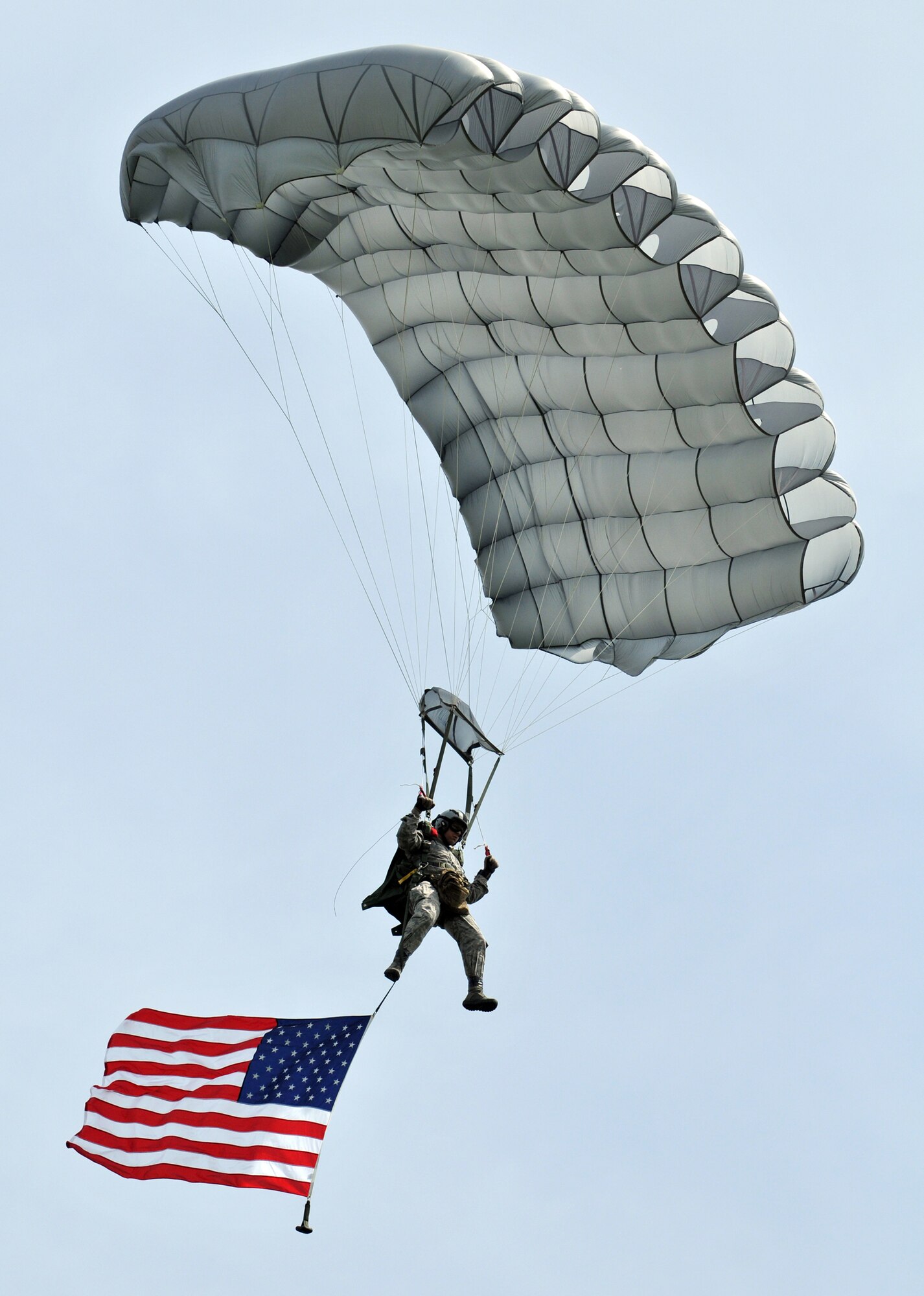 A member of the 321st Special Tactics Squadron flies the American flag June 5, 2010, over the famous "Iron Mike" drop zone in Normandy, France, where the Allies first landed in the D-Day invasion of World War II. The jump was part of a ceremony commemorating the 66th anniversary of D-Day. The 321st STS is from Royal Air Force Mildenhall, England. (U.S. Air Force photo/Staff Sgt. Austin M. May)