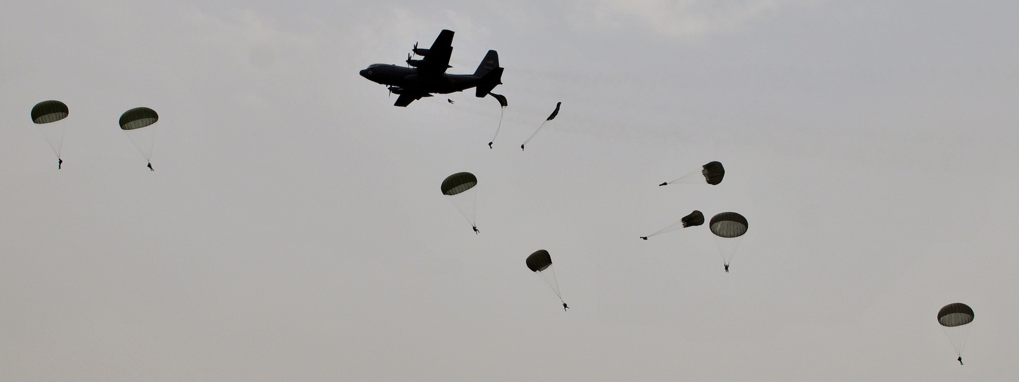 An MC-130P Combat Shadow from the 67th Special Operations Squadron drops static-line paratroopers over the famous "Iron Mike" drop zone June 5, 2010, near the town of St. Mere Eglise, France, which was the same drop zone used by the Allies invading Nazi-occupied France on D-Day. Five members of the 321st Special Tactics Squadron participated in the static-line jump. The 67th SOS and the 321st STS are from Royal Air Force Mildenhall, England. (U.S. Air Force photo/Staff Sgt. Austin M. May)