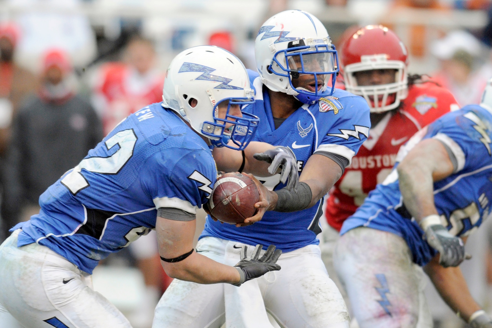 Falcons quarterback Tim Jefferson hands the ball to fullback Jared Tew during the 2009 Bell Helicopter Armed Forces Bowl. Air Force defeated the University of Houston 47-20 on Dec. 31. The U.S. Air Force Academy football team here has the second-highest multi-year Academic Progress Rate of any team in the Football Bowl Subdivision. The Falcons will launch back into action for the 2010 season Sept. 4, 2010 against Northwestern State.  (U.S. Air Force photo/ Bill Evans)